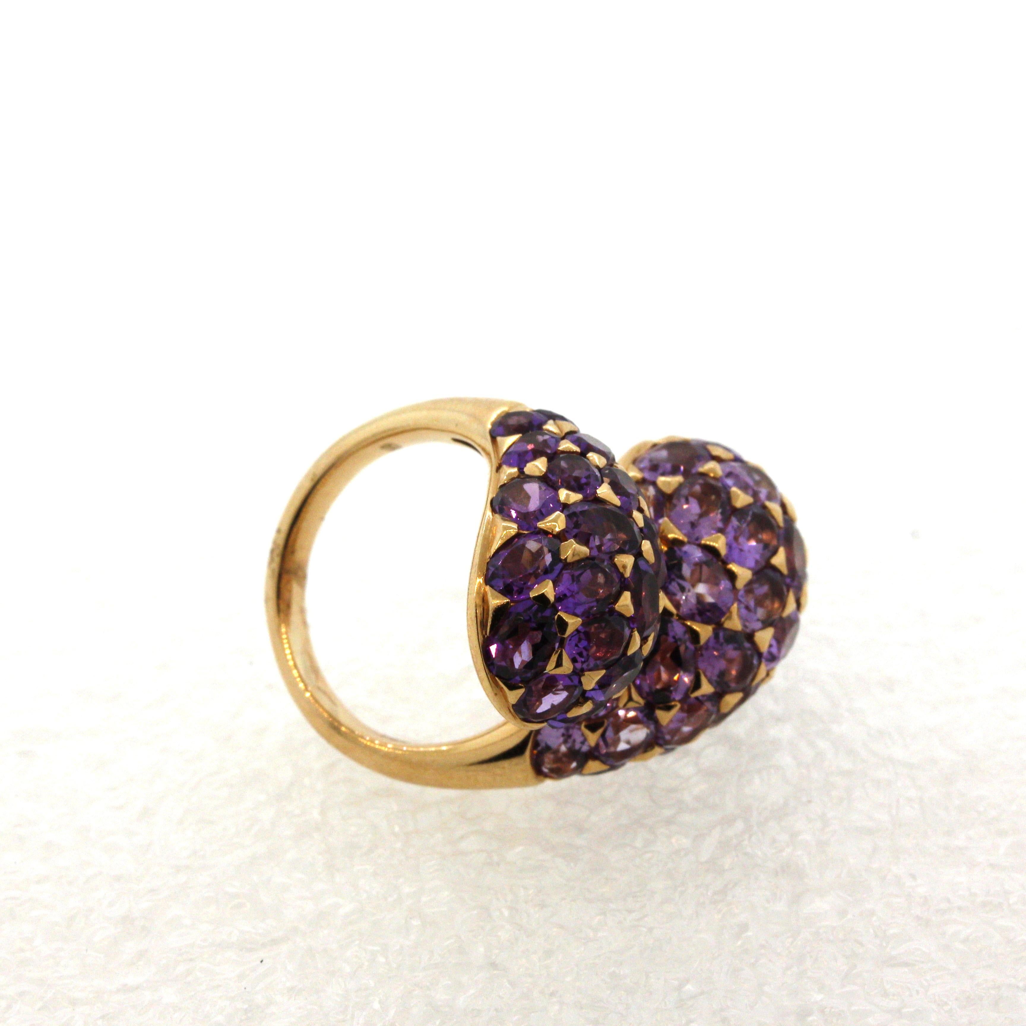 A large, fun, and impressive bypass-style ring featuring 10.86 carats of oval-shape amethyst! The two bypasses possess different shapes of amethyst, one a lighter color while the other a deeper royal purple color. This creates contrast in the piece