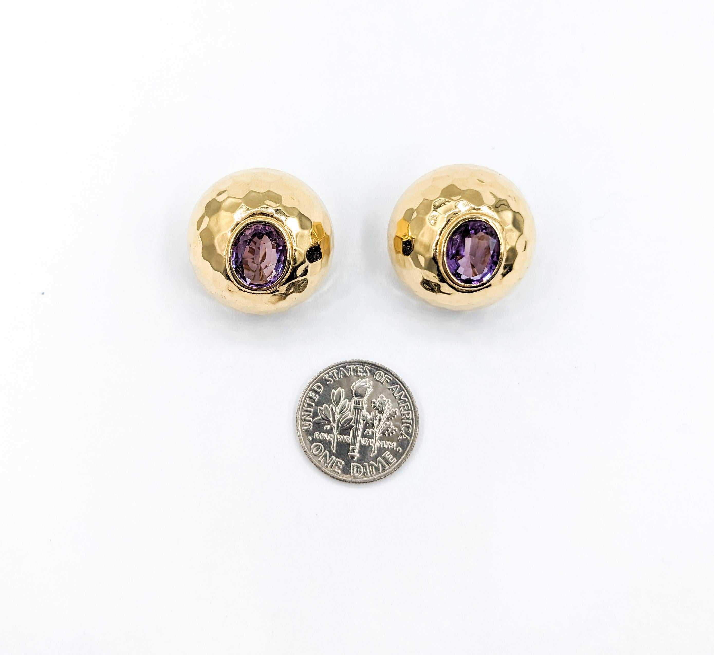 Vintage Amethyst Hammered Clip On Earrings in 14K Gold

Elevate your vintage style with these exquisite clip-on earrings, masterfully crafted in radiant 14-karat yellow gold. These earrings feature a beautiful hammered texture and are each adorned