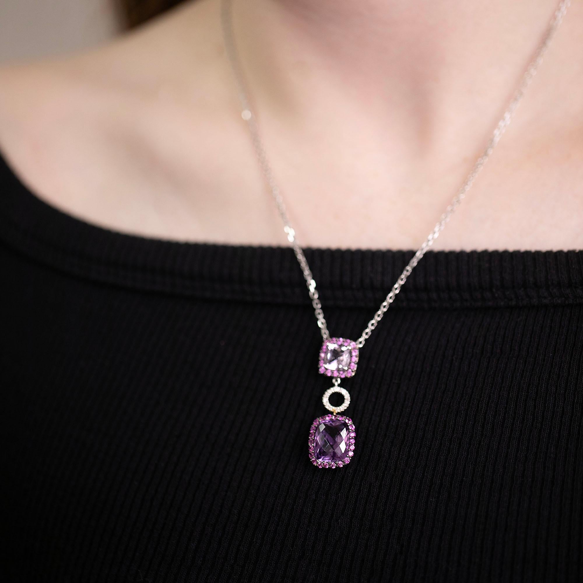 Modern amethyst, pink sapphire & diamond necklet, featuring double drop pendant in 14k gold and black rhodium detail. A fun play of colour to a glamorous piece of jewellery with an unique checkerboard cushion cut amethyst.

Gemstone: One Amethyst