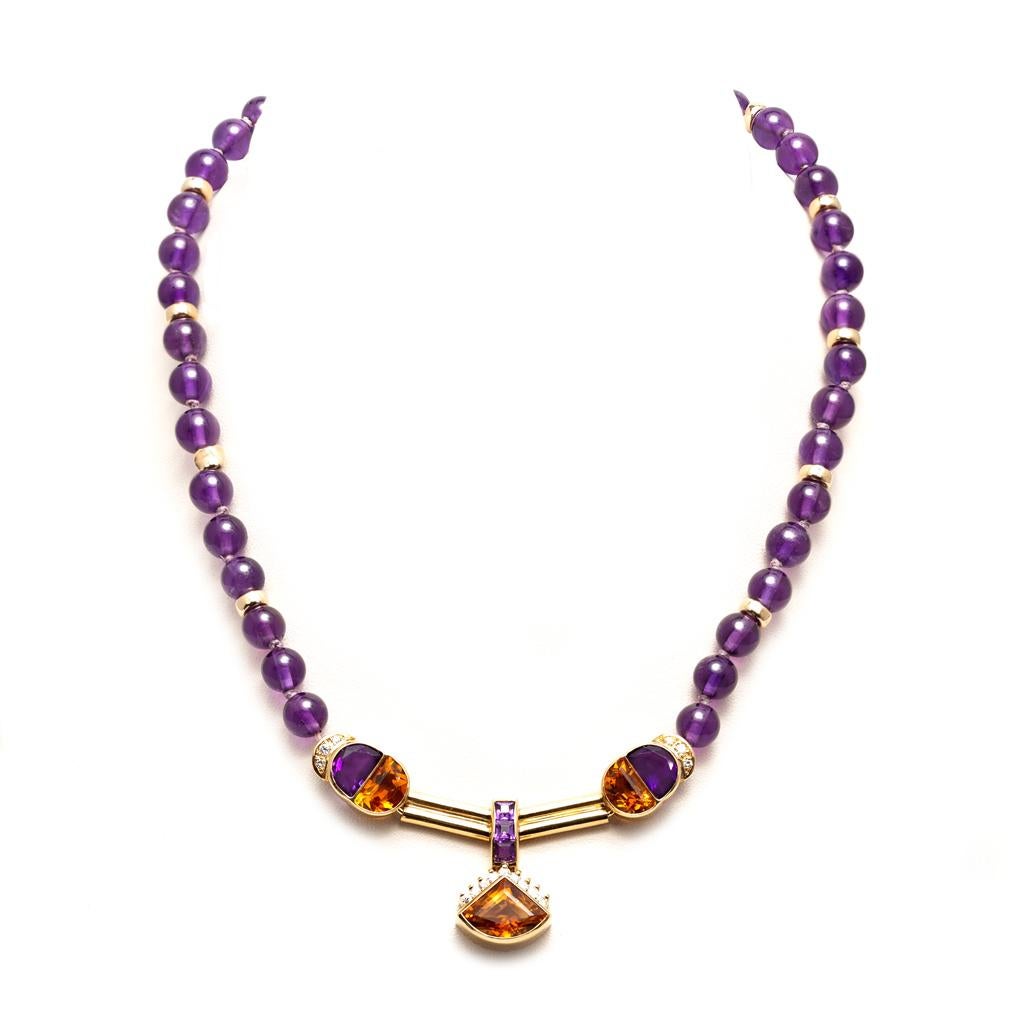 A Modern 18-karat yellow gold necklace with amethyst, diamond, and citrine made in Italy, circa 1980. It boasts an exquisite mix of colors that complement one another beautifully.  The necklace presents a hook-style clasp, it is 14.75 inches in
