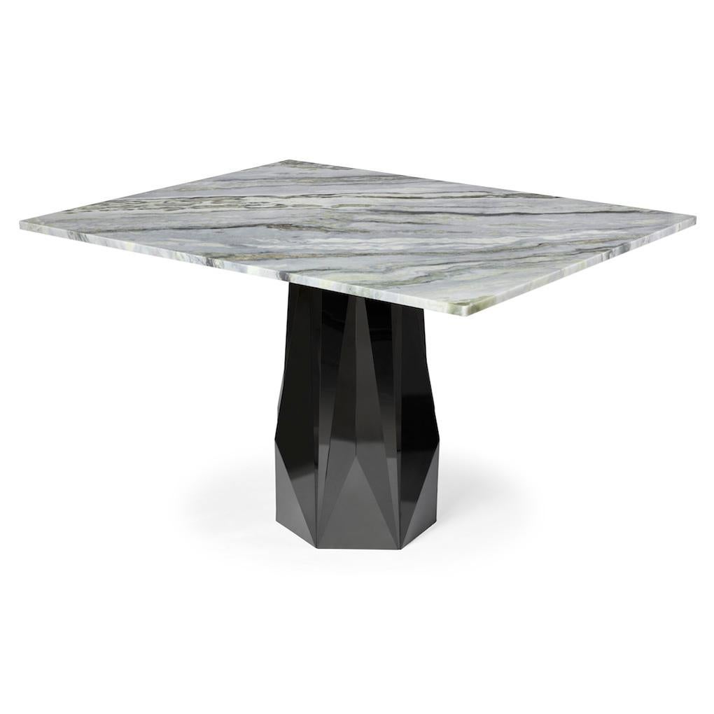 Hand-made table with a marble top and a base of mirror polished stainless steel.

Iz-Type has produced a unique, high-end, artistic finish by merging contrasting raw materials. Mirror polished stainless steel and marble are seamlessly blended in