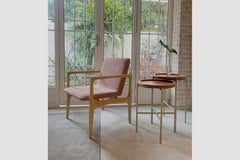 Modern and minimalist “Oscar” armchair, made of solid wood upholstered in fabric