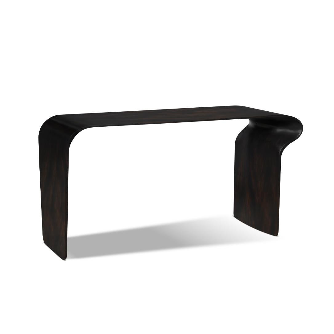 Made from molded wood, this modern and organic console table has one side curved out and the other side flat, making it distinctively asymmetrical and simple.
 