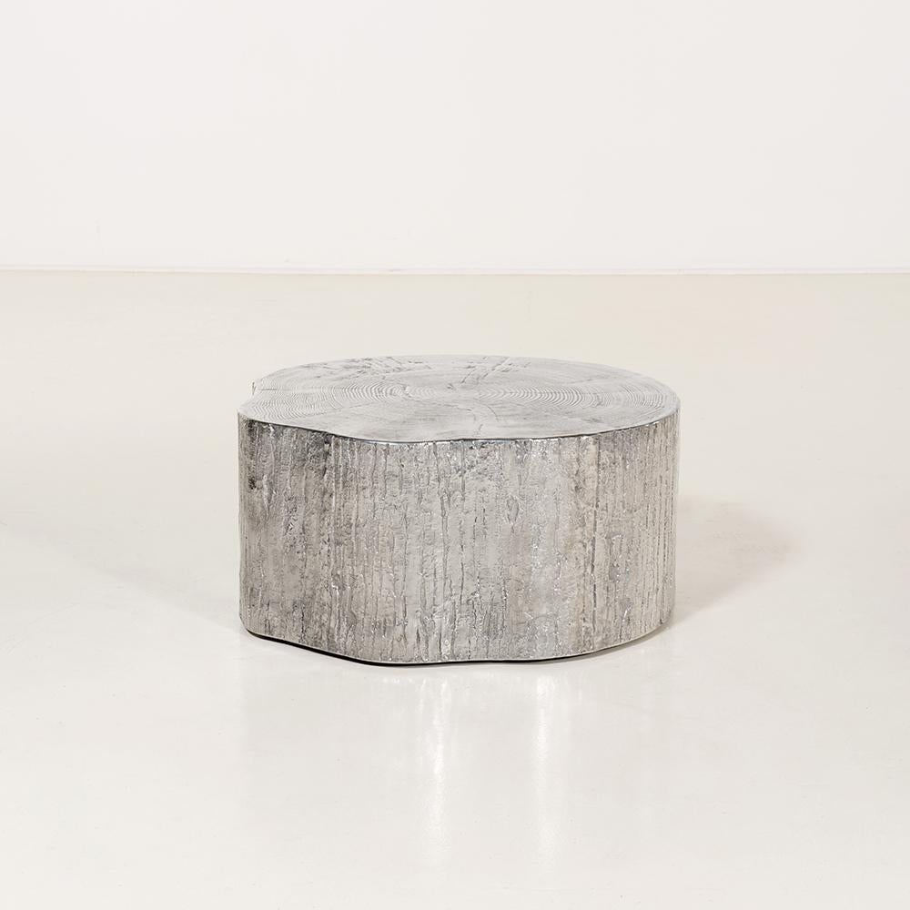 COFFEE TABLE in cast aluminium with wooden-textured shape designed by Andrea Salvetti for Dilmos Milano. 
The table represents a piece of trunk casted in polished aluminium. 

Signed by the artist.
Suitable also for outdoors.

Available in different