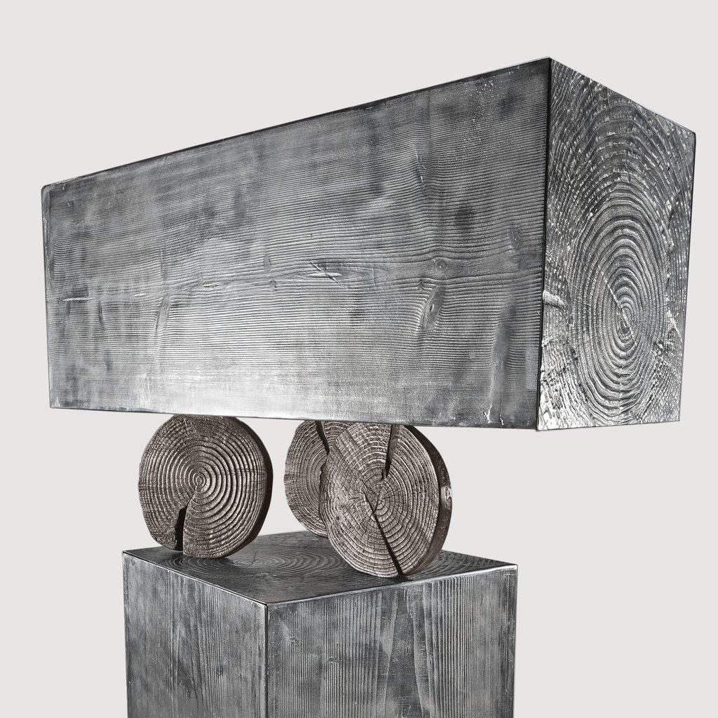 TOTEM cabinet in aluminum cast with wooden-textured container modules suspended by trunk sections for Dilmos Milano. Composed of 2 doored cabinet structures.
Signed and numbered by the designer.
Suitable for outdoors.

Available also in aluminum