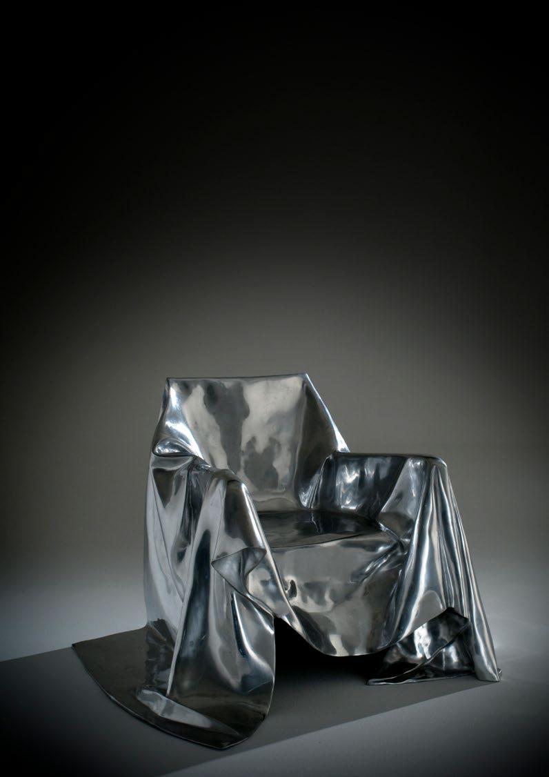 Extraordinary armchair made in lost wax-casting aluminium for Dilmos Milano. The artist Andrea Salvetti was inspired by the posture of the Madonna holding Christ in the famous Pietà sculpture of Michelangelo in Rome. The armchair's structure is made