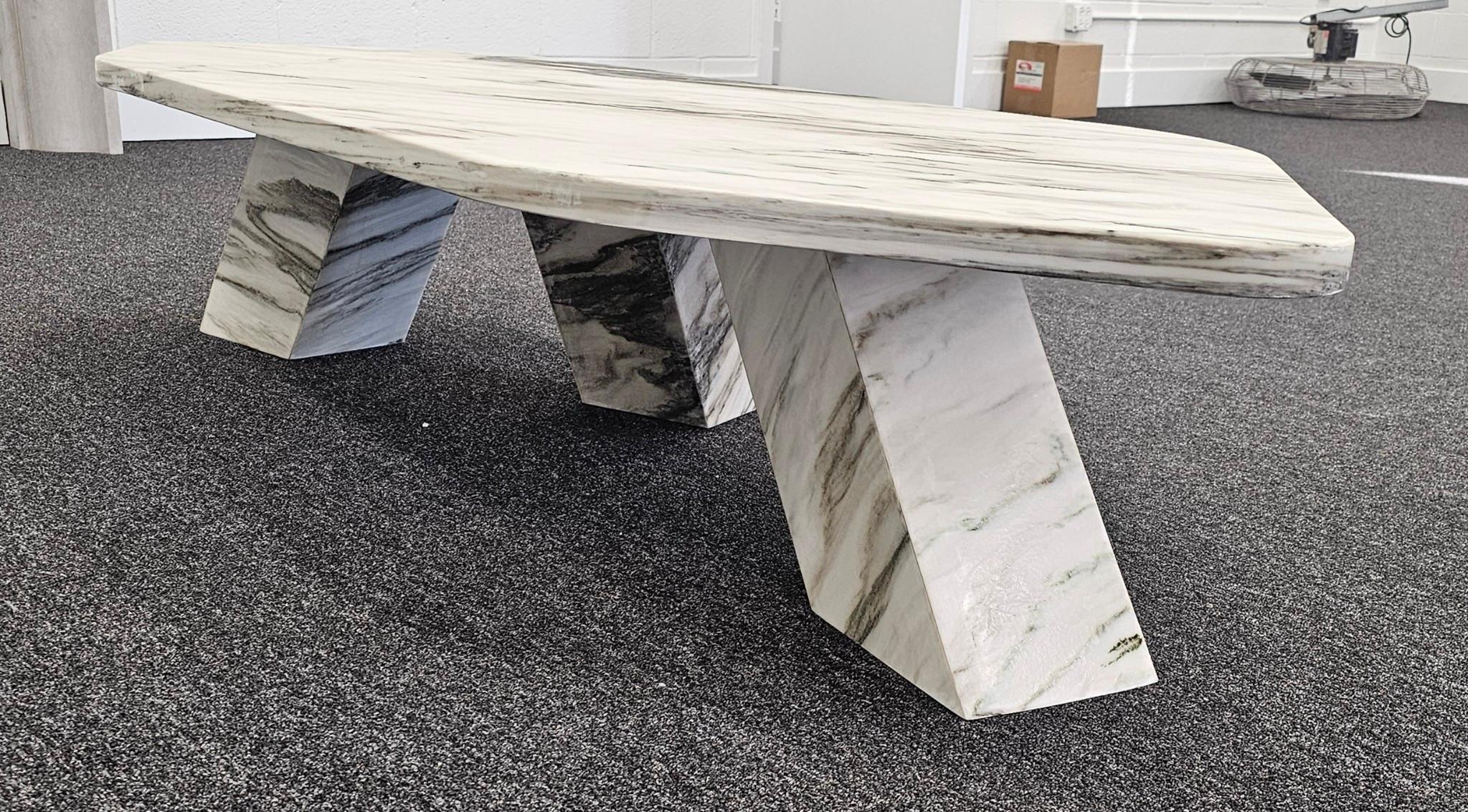 This contemporary-styled marble coffee table is sleek, angular and multi-faceted. It's made from Cipollino, a classic marble that has been quarried in Greece since the time of Ancient Greece and Rome.  But the table's design is contemporary and very
