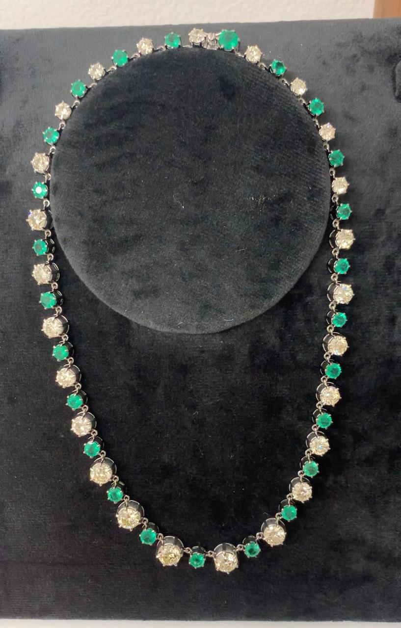 We promise you this is something that you have never seen before!  18K white gold diamond necklace mounted with old cut diamonds and green emeralds. 21.15 carats in old cut diamonds that glisten in every light including candle light and 10.56 carats