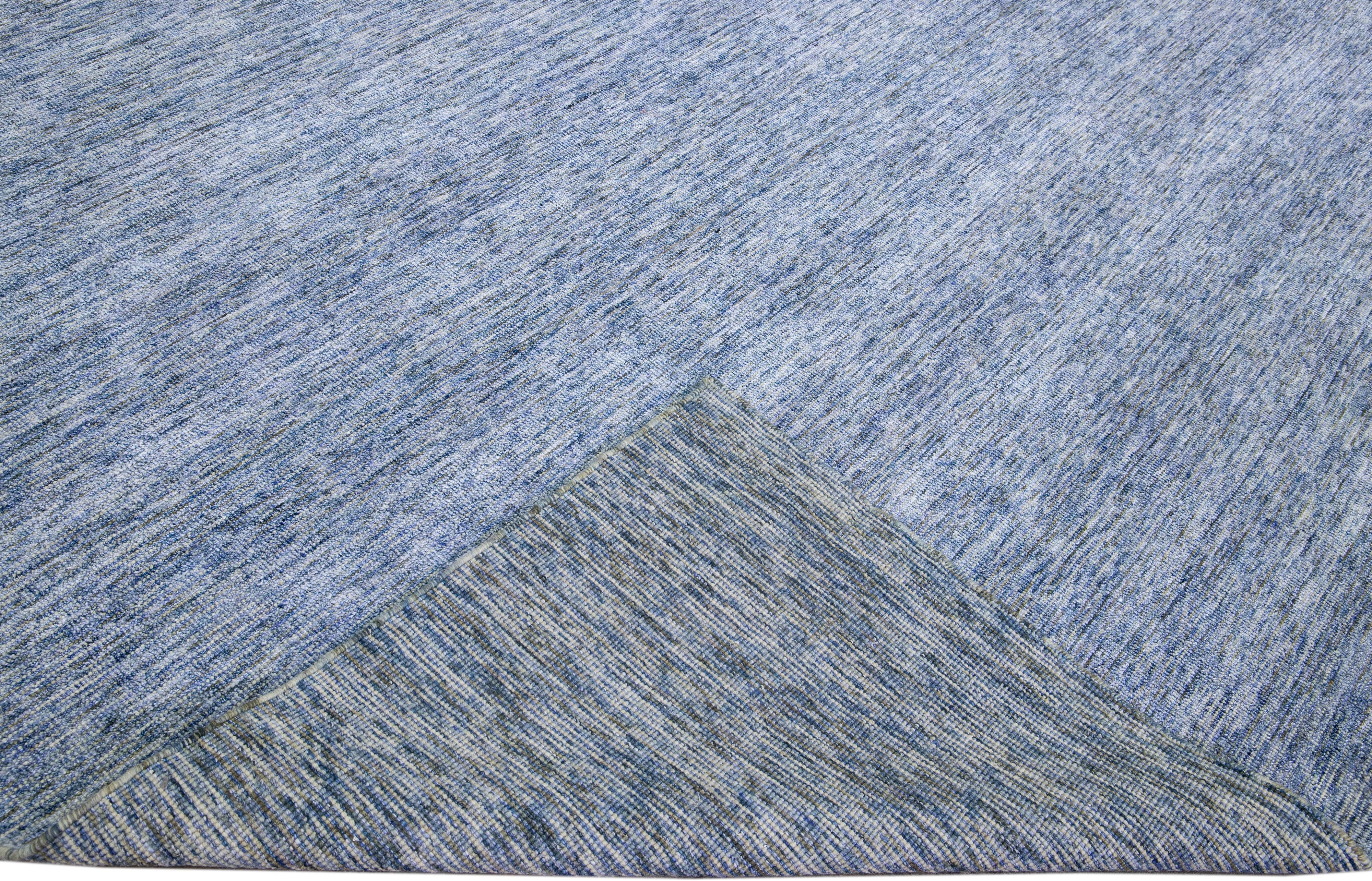 Beautiful Apadanas's handmade bamboo & silk Indian groove rug with the blue field. This groove collection rug has an all-over solid design.

This rug measures: 12' x 15'.

Custom colors and sizes are available upon request.

