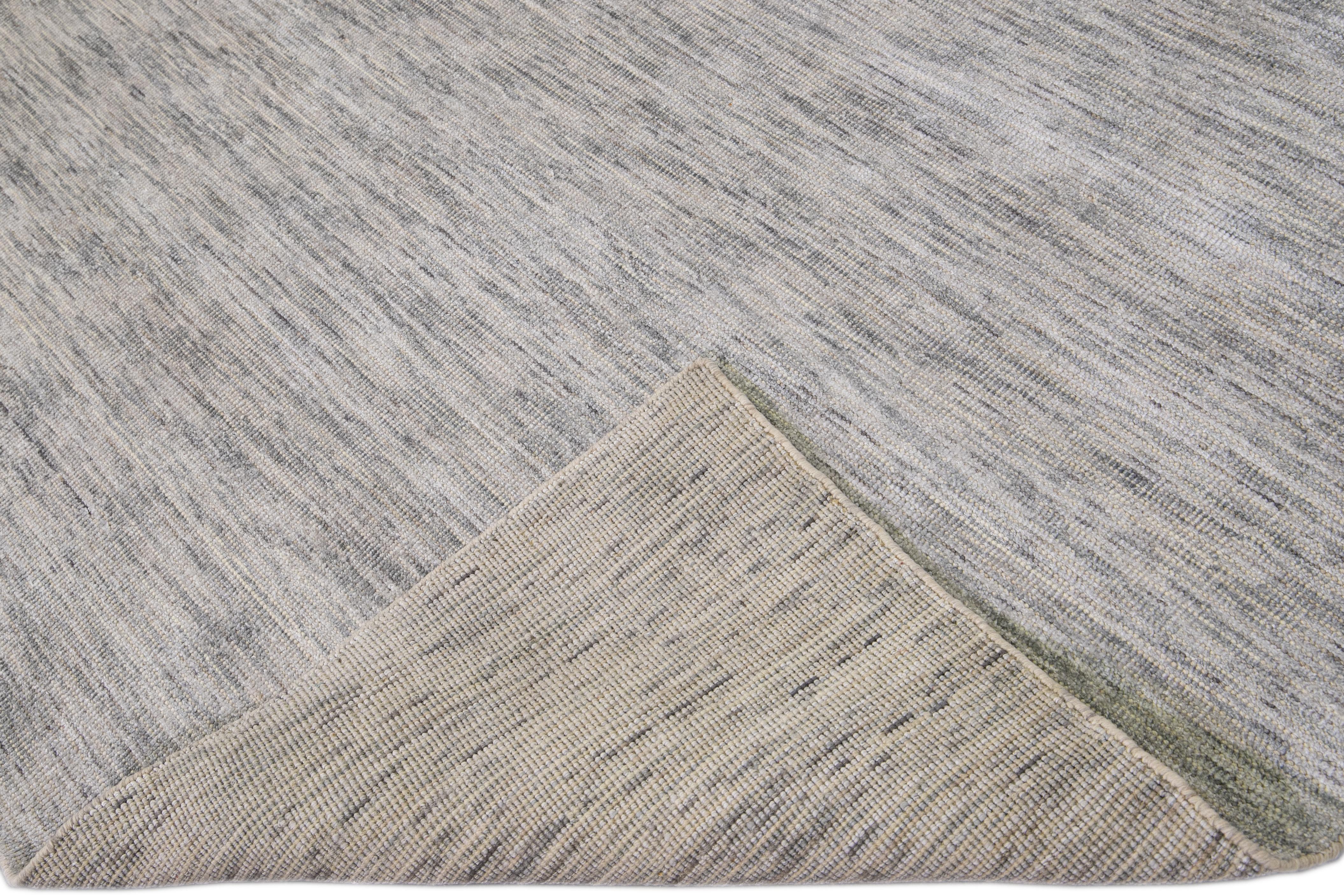 Beautiful Apadanas's handmade bamboo & silk Indian groove rug with the gray field. This groove collection rug has an all-over solid design.

This rug measures: 9' x 12'.

Custom colors and sizes are available upon request.

