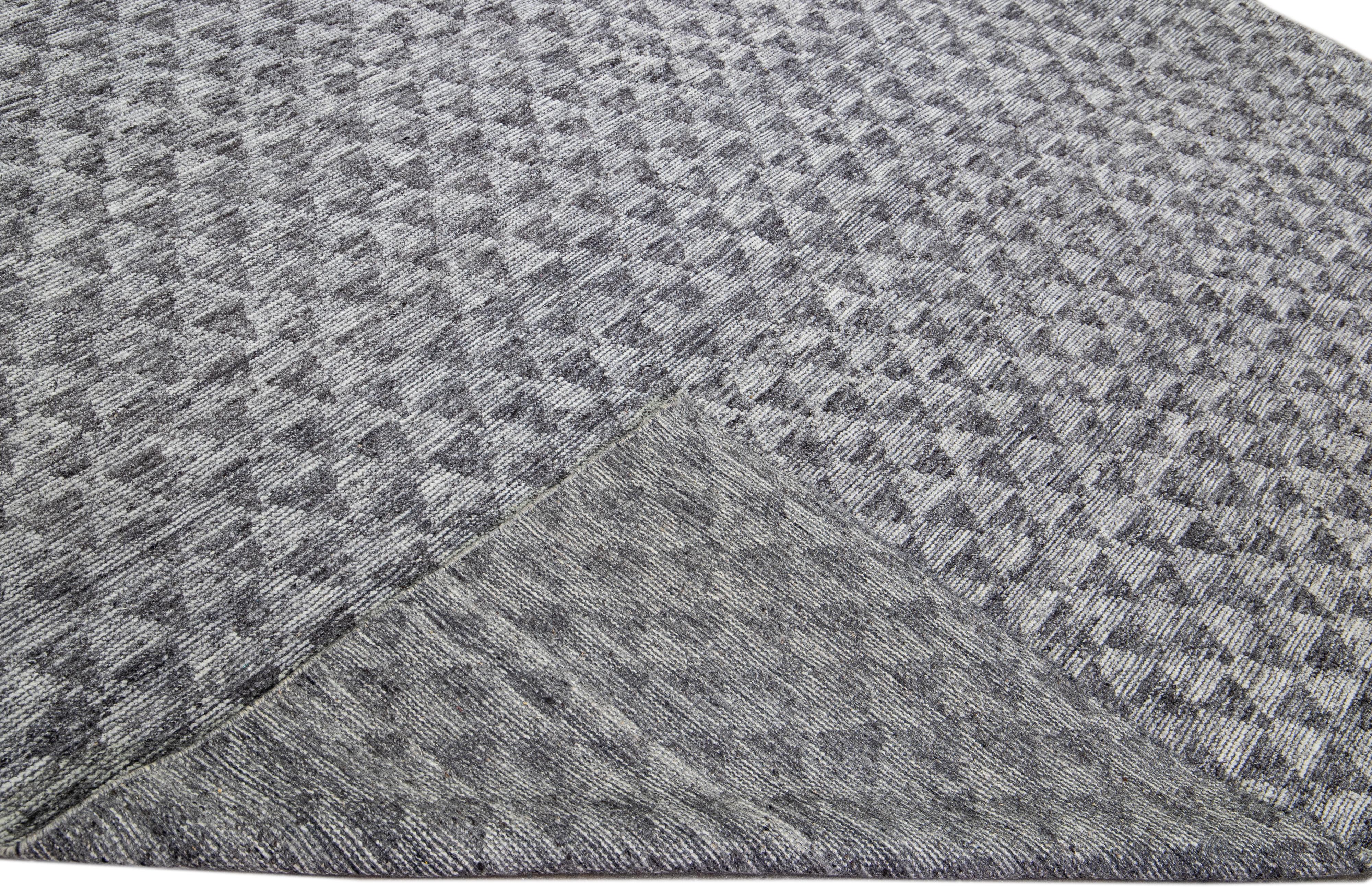 Beautiful modern Apadana's Safi Collection hand-knotted wool rug with a gray field. This Modern rug has gray accents in a gorgeous all-over geometric design.

This rug measures: 9'3