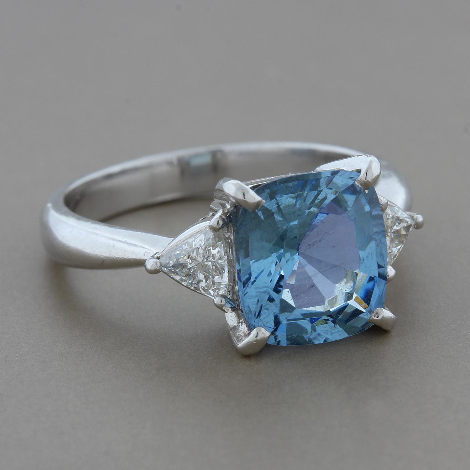 A stunning 2.34 carat cushion cut aquamarine in an ocean blue color centers this beautiful ring.  Two trillion cut diamonds, totaling 0.32 carats, are set on the sides for added sparkle!  All set in platinum.

Currently ring size 6.25
