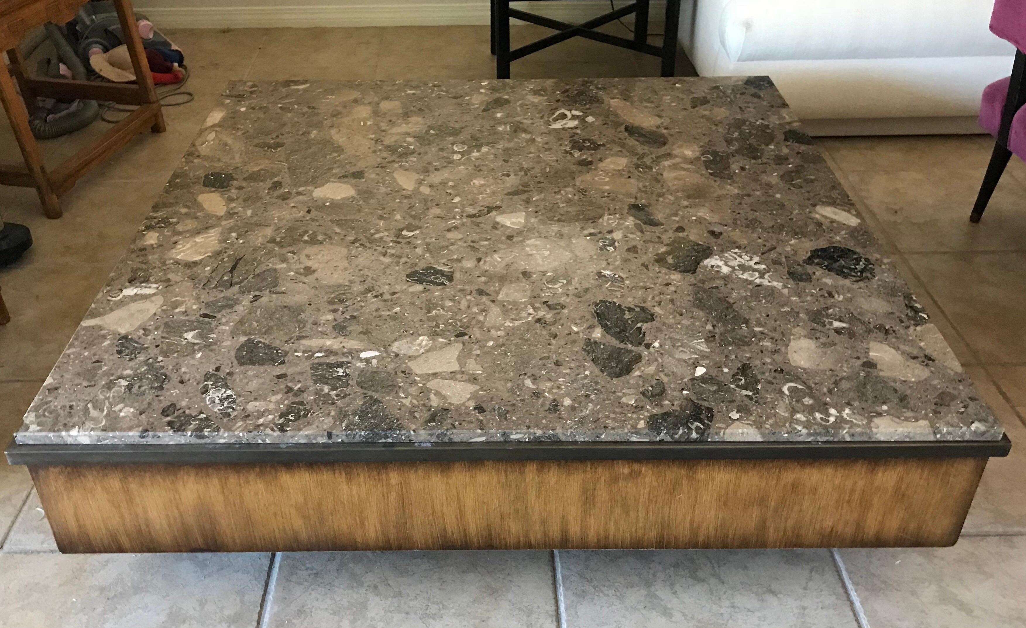 From a stunning Mid-Century Modern Estate (to call it a residence is inadequate) full of A list art and furnishings, is this brown marble, bronze and wood large, square coffee table. The metal trim could be antique brass, but appears to be bronze.