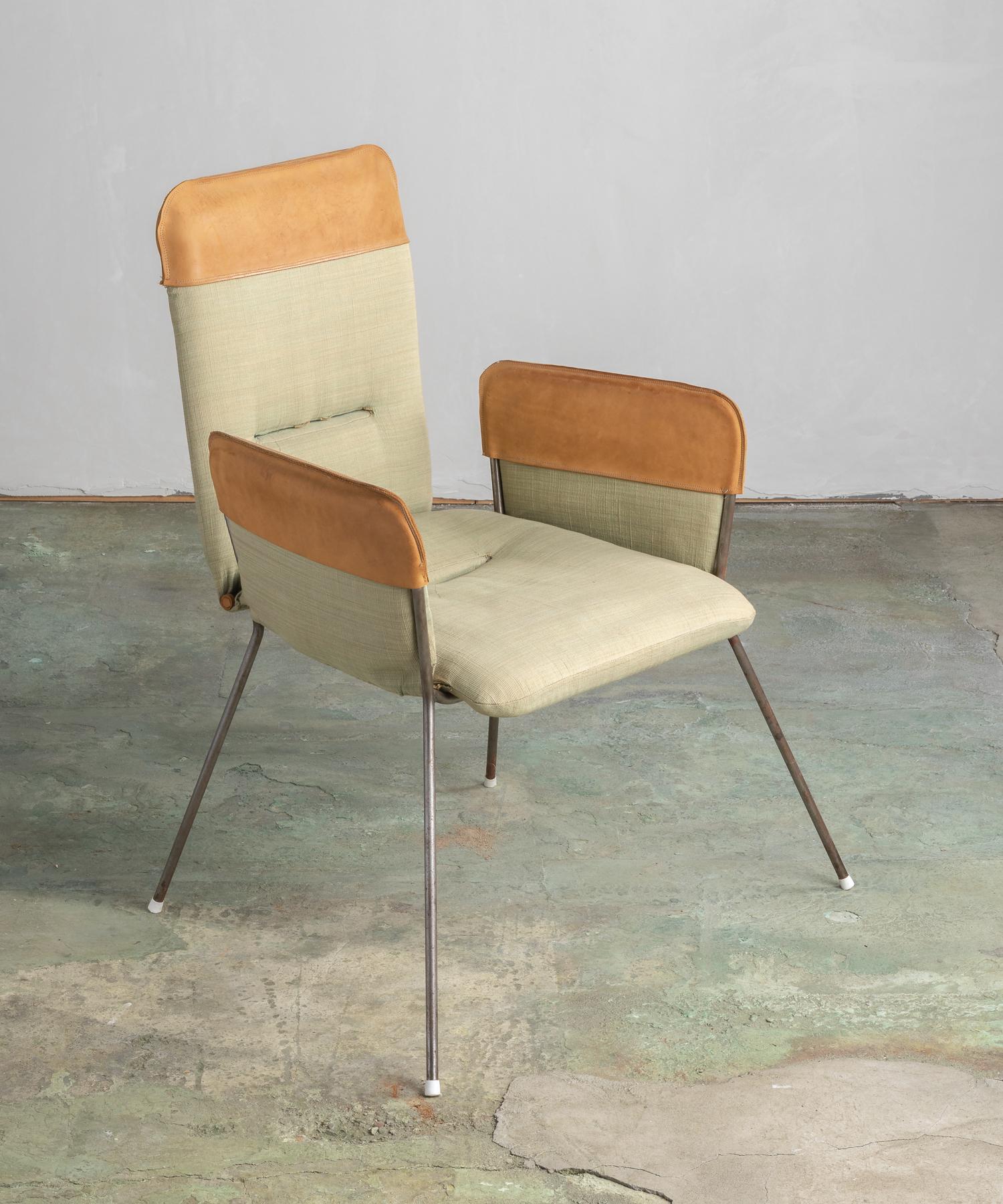 Modern armchair, America, 20th century.

Simple form includes original upholstery and leather accents.