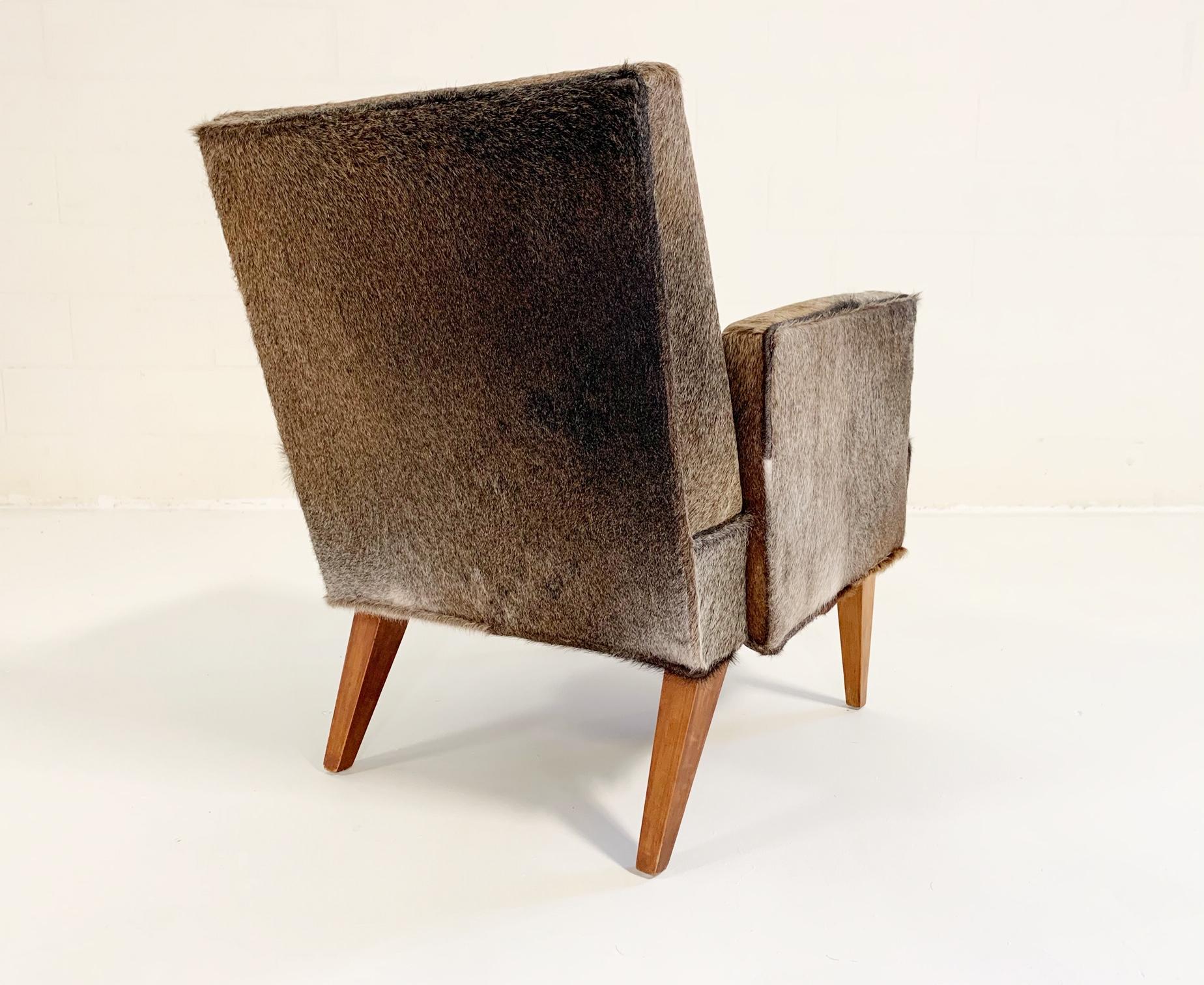 We completely restored the chair down to the frame and upholstered in our popular salt and pepper Brazilian cowhide. This is a perfect side chair for a den or bedroom.