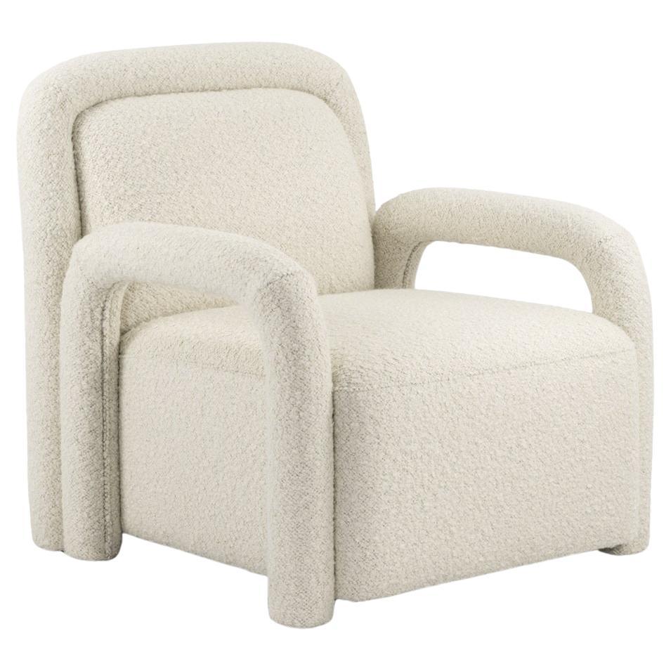 Fauteuil moderne avec accoudoirs tubulaires et tapisserie Bouclé