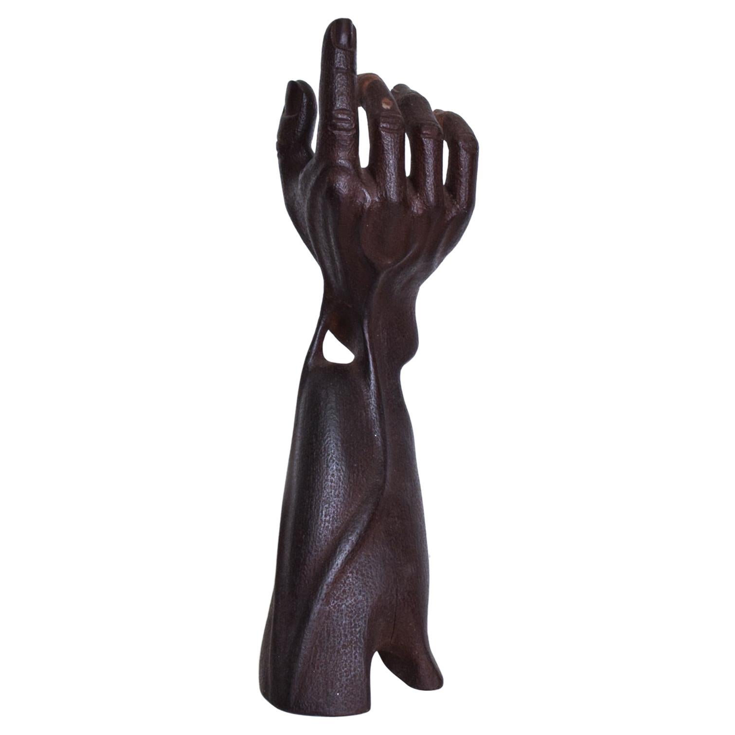 black hand statue
