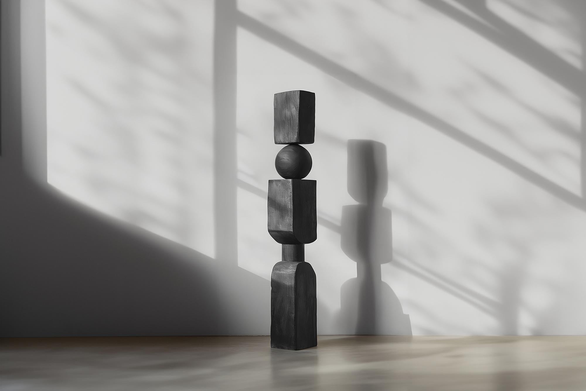 Modern Art Carved in Sleek Dark Black Solid Wood, NONO's Still Stand No99

——

Joel Escalona's wooden standing sculptures are objects of raw beauty and serene grace. Each one is a testament to the power of the material, with smooth curves that flow