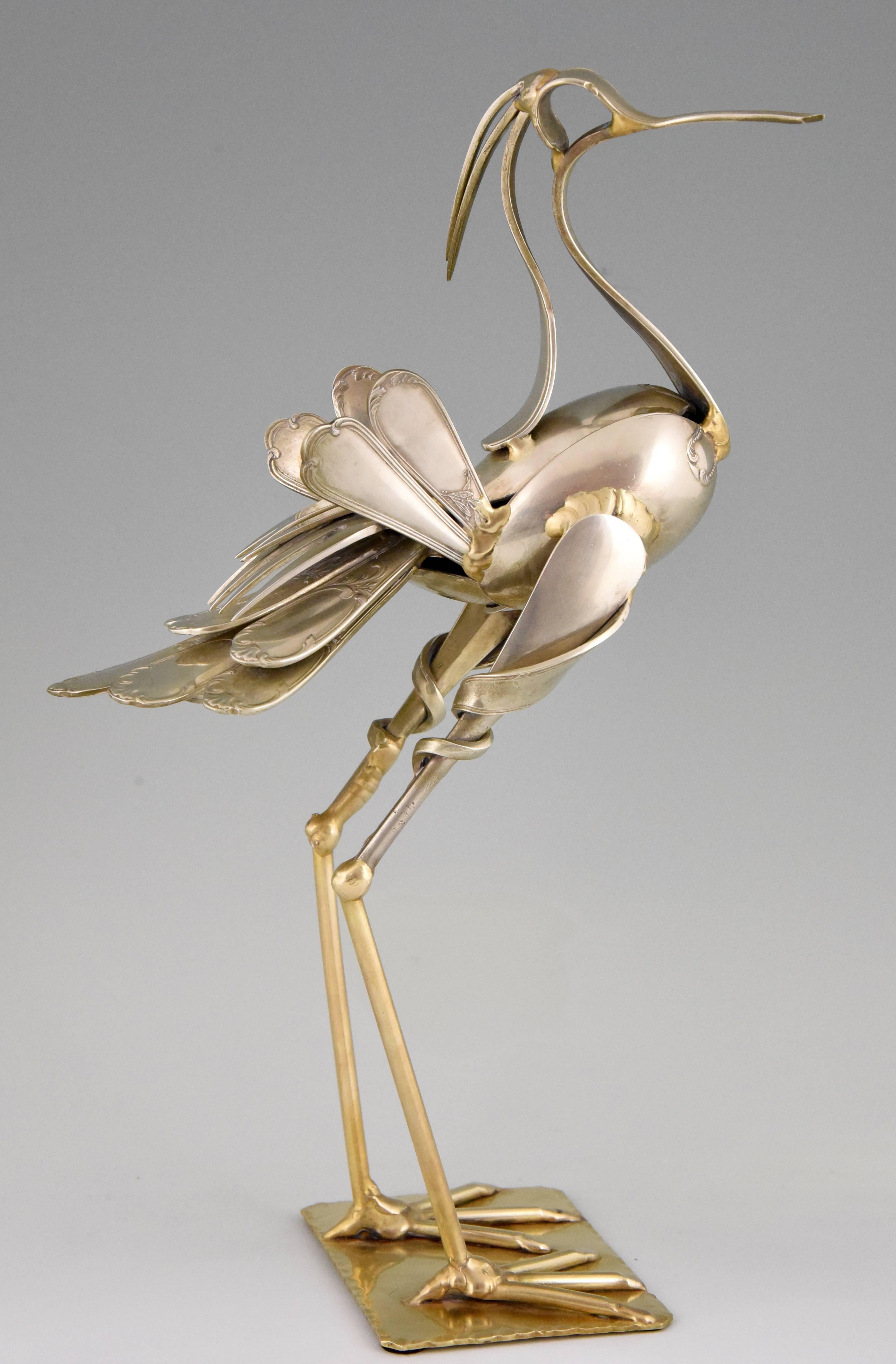An original cutlery sculpture of a bird made of antique forks and spoons by the famous French artist Gérard Bouvier, signed and dated 1998. 

Artist/ Maker: Gerard Bouvier
Signature/ Marks: G. Bouvier, 98
Style: Modern.
Date: 1998
Material: