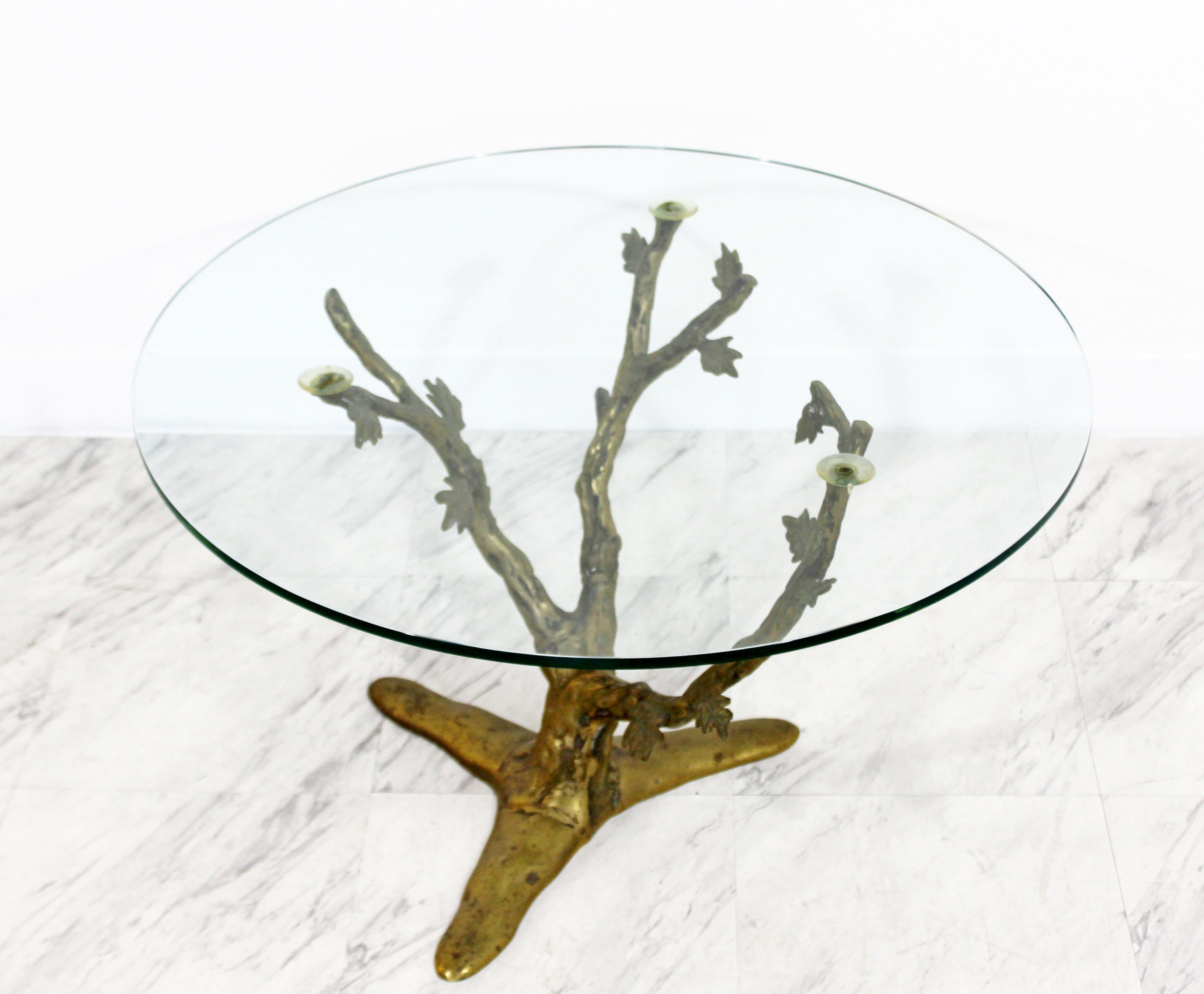 For your consideration is a fantastic cast bronze side or end table, with a three limb branch base, and a round glass top. In excellent condition. Attributed to Jacques Duval Brasseur. The dimensions are 28