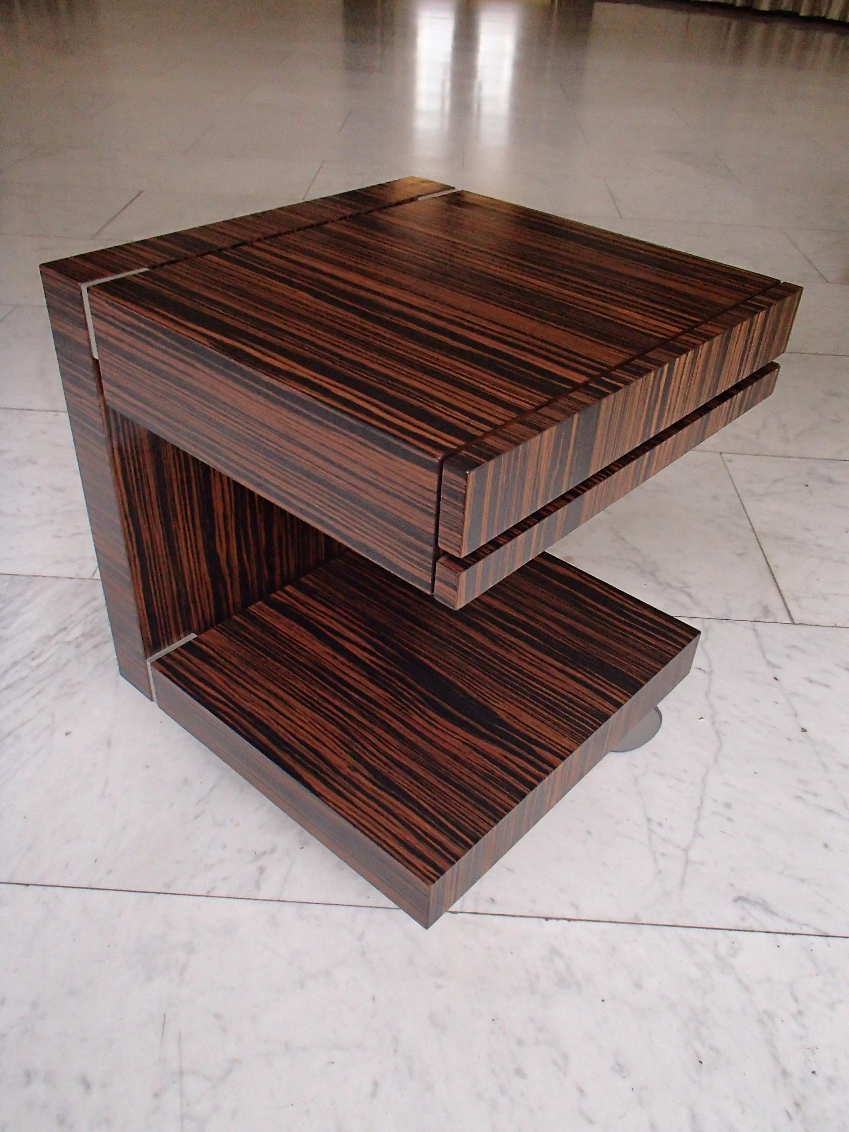 Modern Art Deco ebene de macassar side table or nightstand with drawer on wheels
by Swissflex an high end swiss manufacterer.