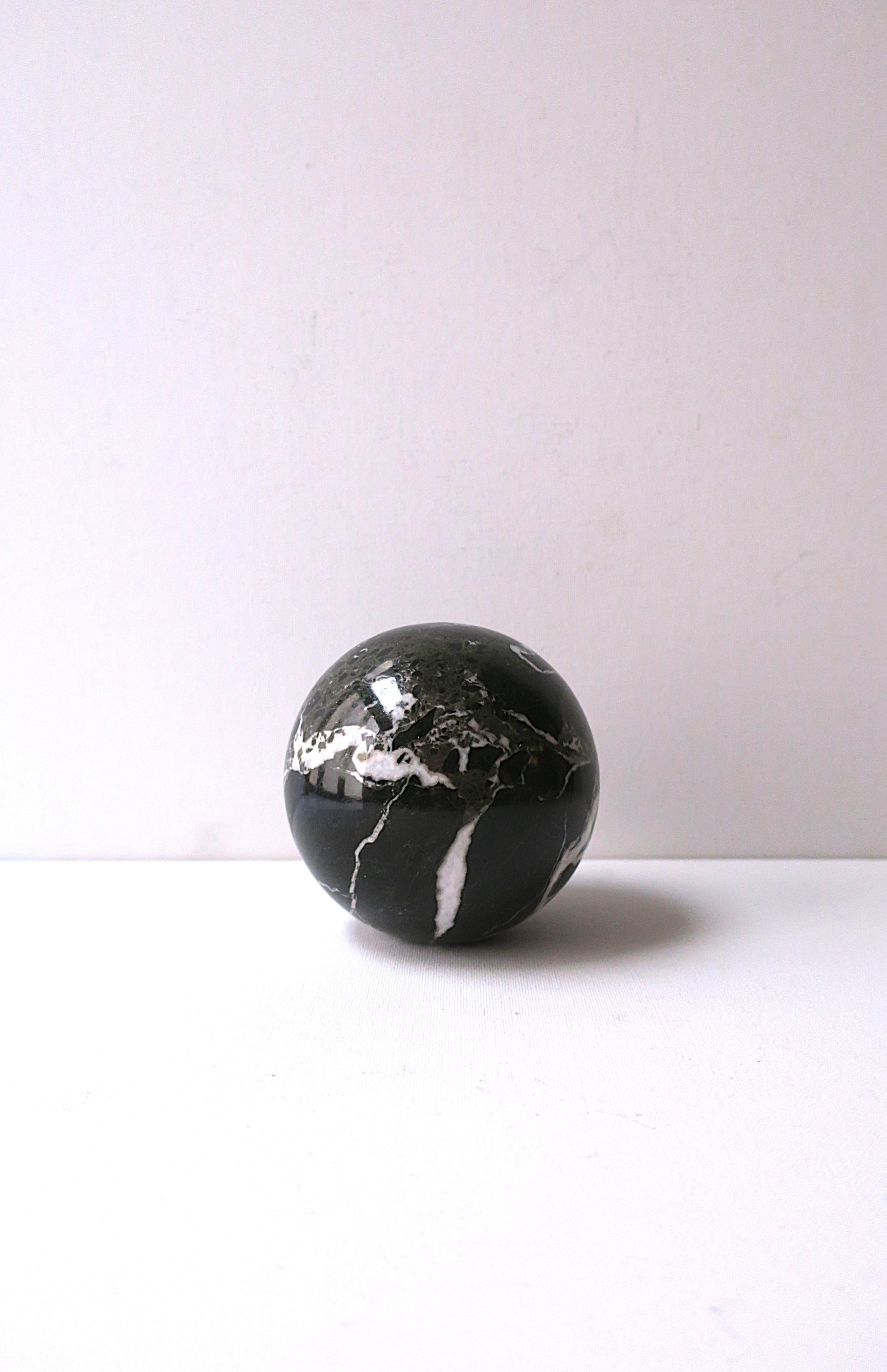 A substantial marble round ball sphere in dark grey, dark green, taupe and white hues, in the Art Deco Modern design style, circa late-20th century, 1970s. A great decorative object as shown in images. Flat bottom for stability. Very good condition