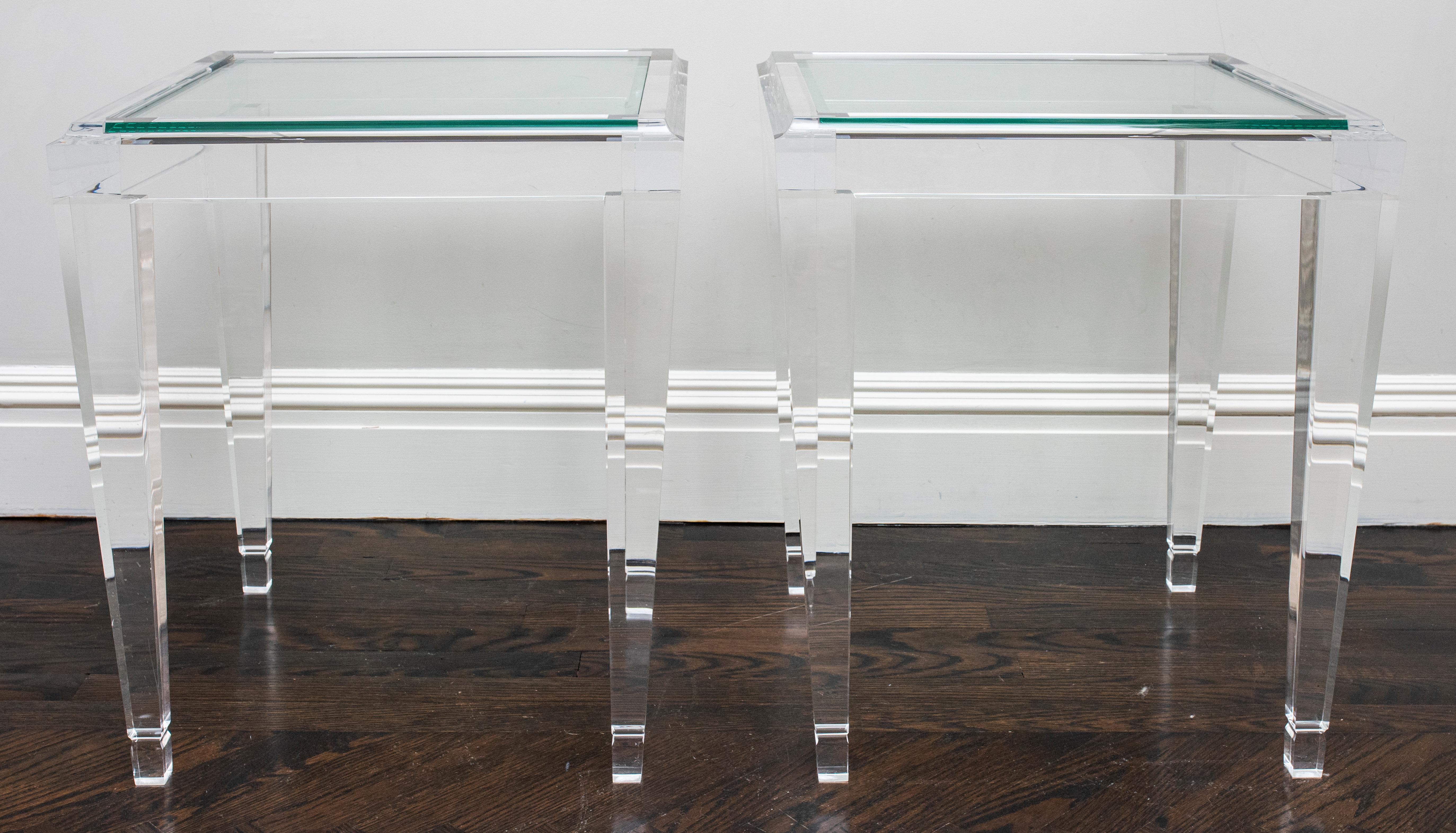 Modern Art Deco revival pair of acrylic side tables with glass tops. Measures: 22.5