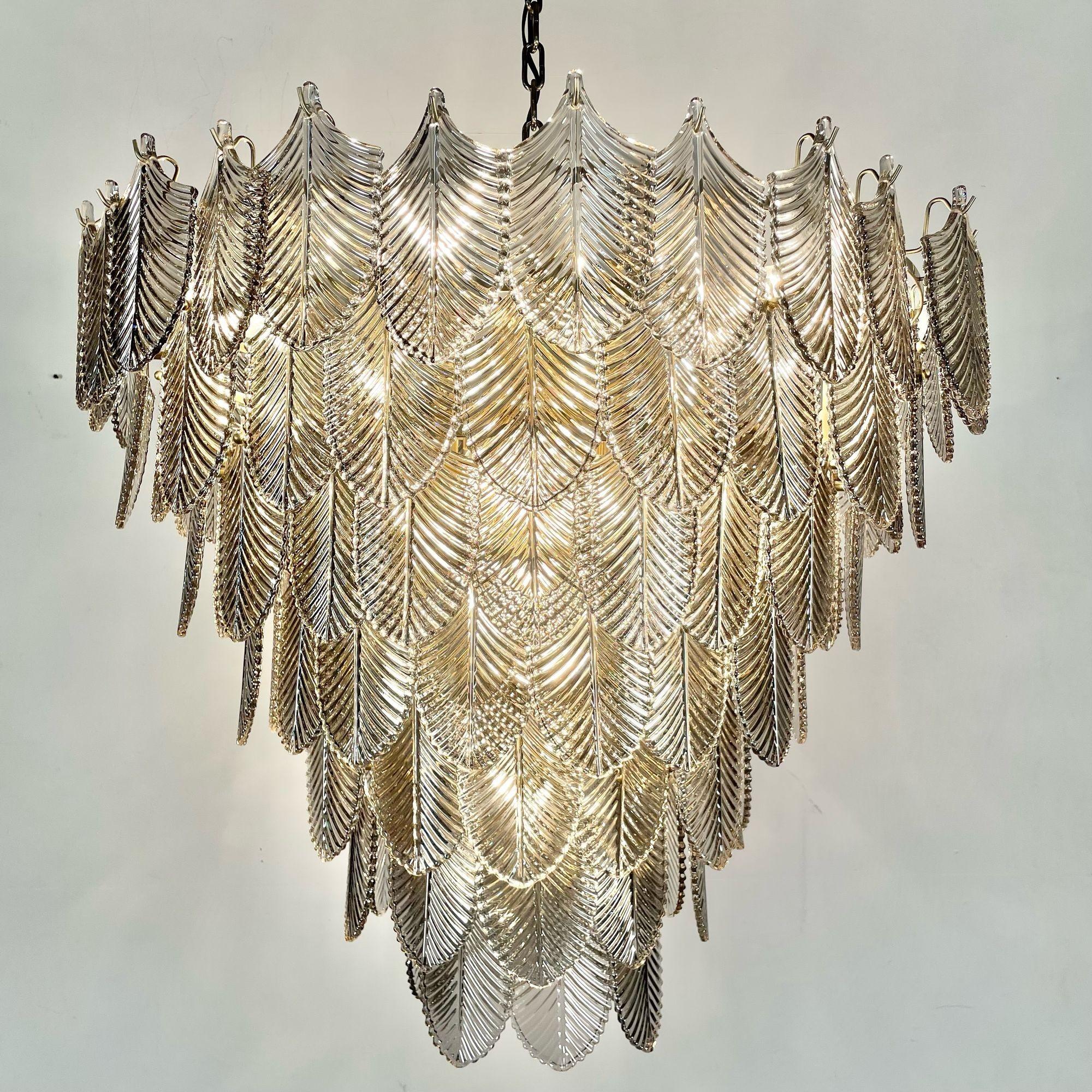Modern Art Deco Style Chandelier / Pendant, Brass and Smoked Glass, Leaf Motif

Update your existing interiors with the Verbier L Chandelier, a real highlight that can be integrated into any modern or classic furnishing style. This tapered pendant