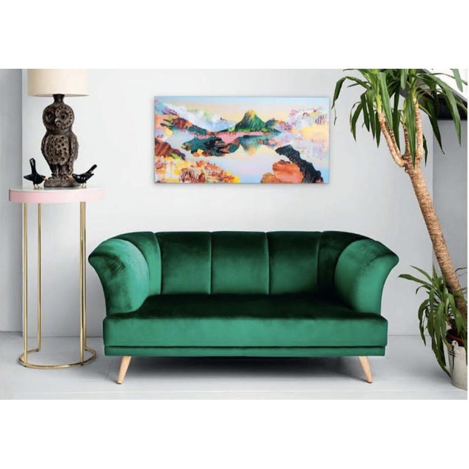 Inspired by the French-Caribbean island of Martinique, this loveseat conveys the tropical vibes from natural materials and warm colors and the French sophistication of Art Deco. The emerald green velvet upholstery evokes the lush greenery of the