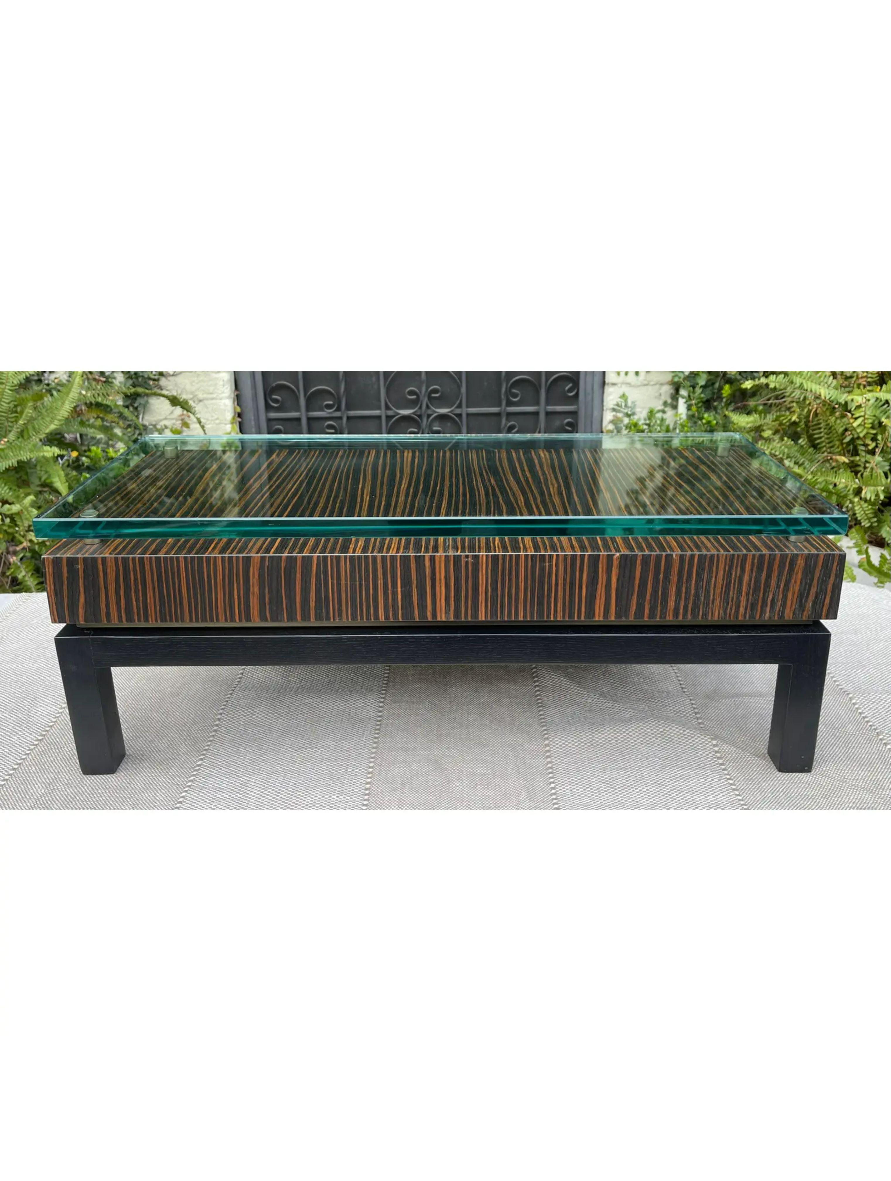 Modern Art Deco Style macassar & glass low table.
Priced each! This listing is for one table but there are two tables available.
Additional information:
Materials: Ebony, Glass
Color: Brown
Period: 1990s
Styles: Art Deco, Modern
Table Shape:
