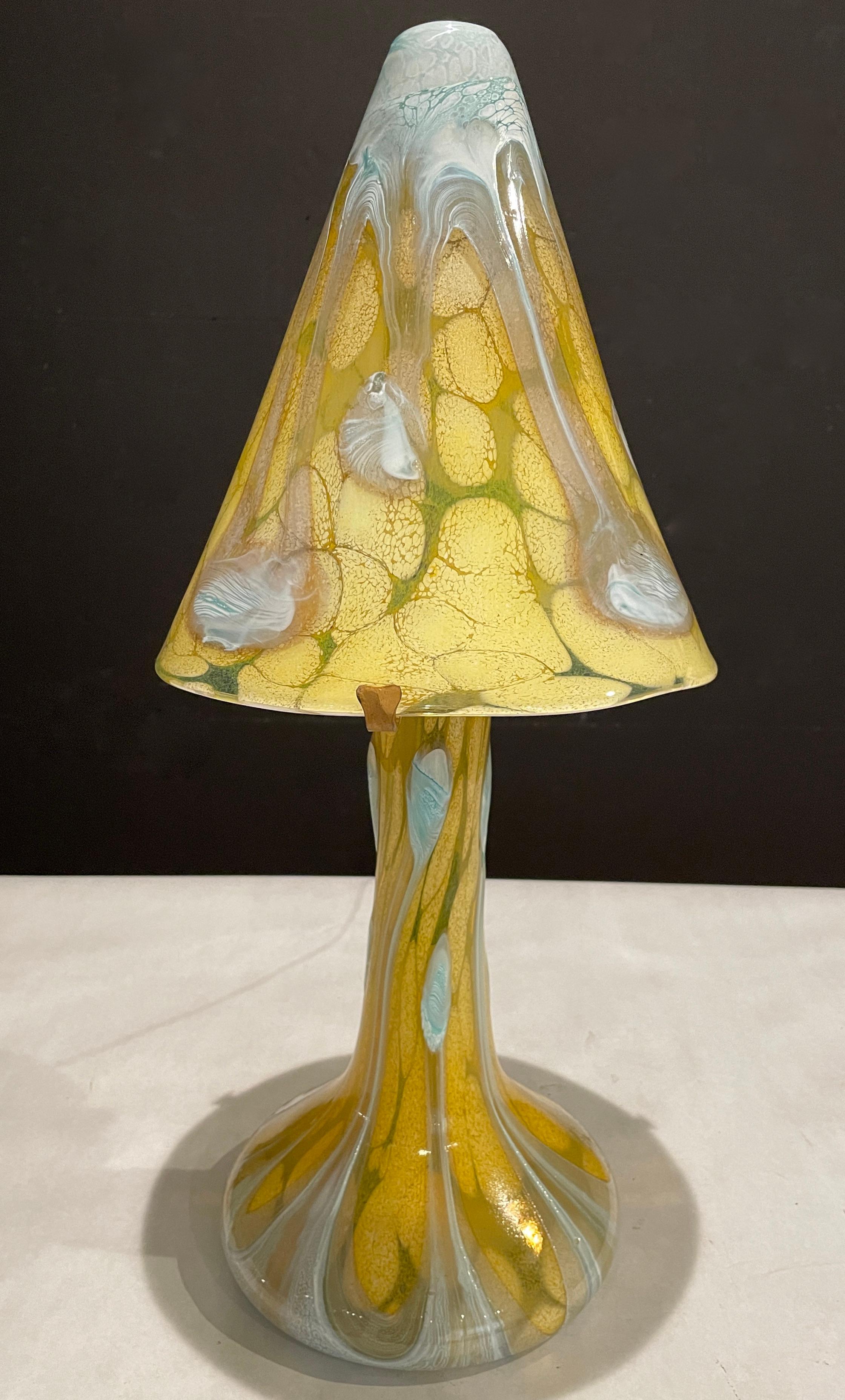 Jean Luc Gambier ( 1948-) signed and dated '06 modern art glass lamp and shade in golden yellows with blues and whites.
Jean  Luc Gambier studied at the school of glass in  Moulins, France, and graduated Top of his  class in 1967. He has worked at