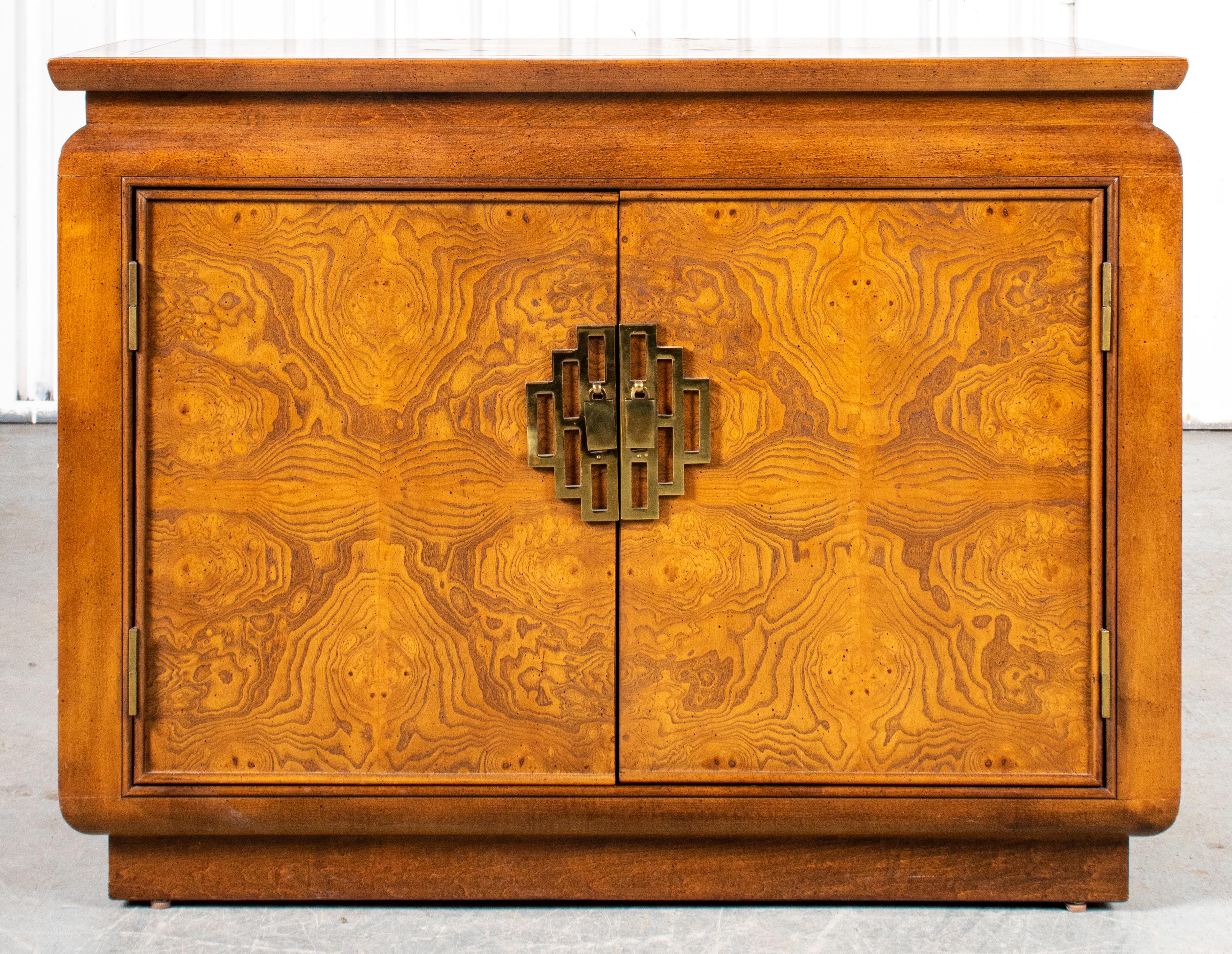 Asian Modern cabinet with wood veneer and brass embellishments in the Art Deco taste of James Mont. 
Measures: 31