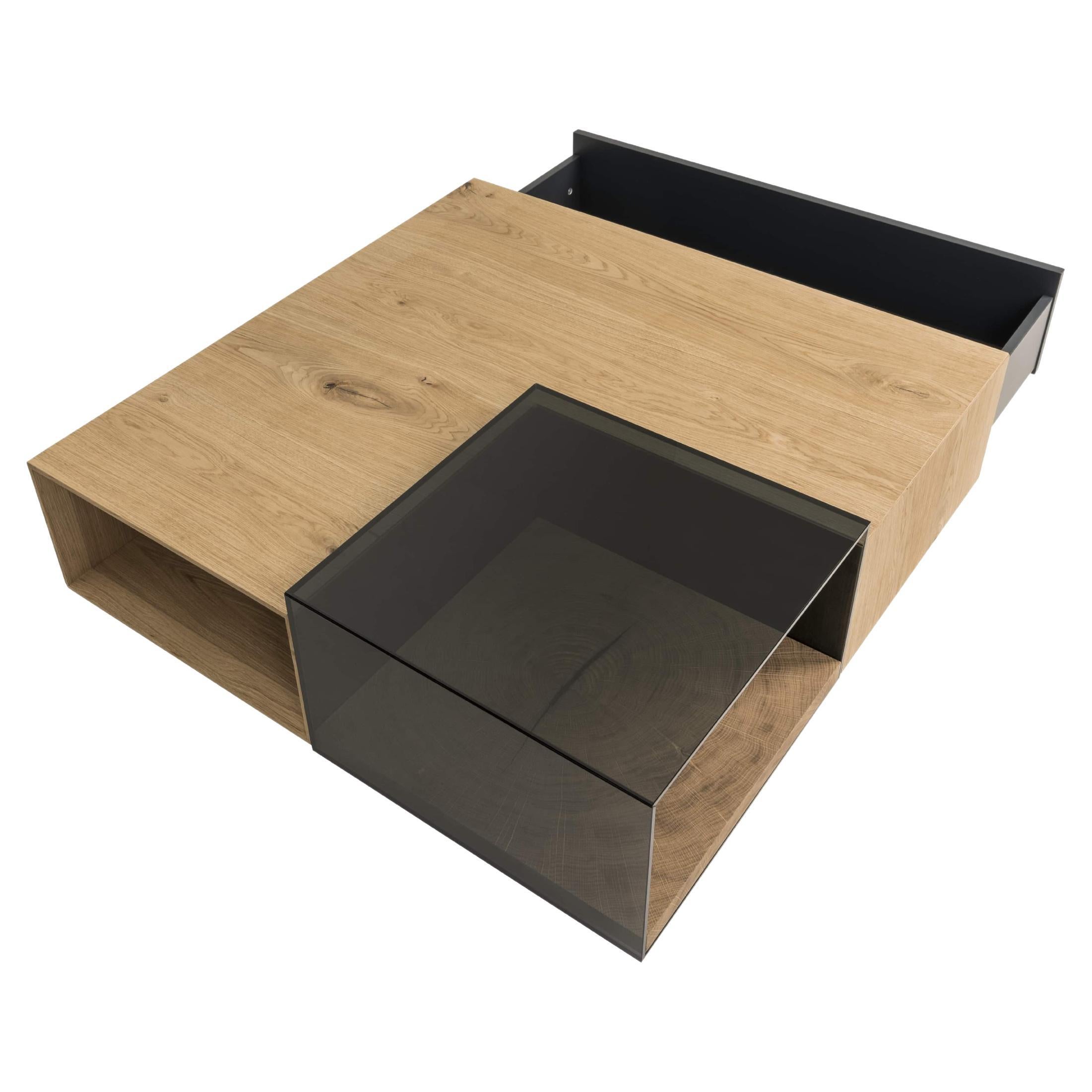 A study in contrast and harmony, this center table merges the warmth of a lacquered wood finish with the sleek elegance of smoked glass. Its architectural structure is both bold and refined, featuring clean lines and a balanced composition. The