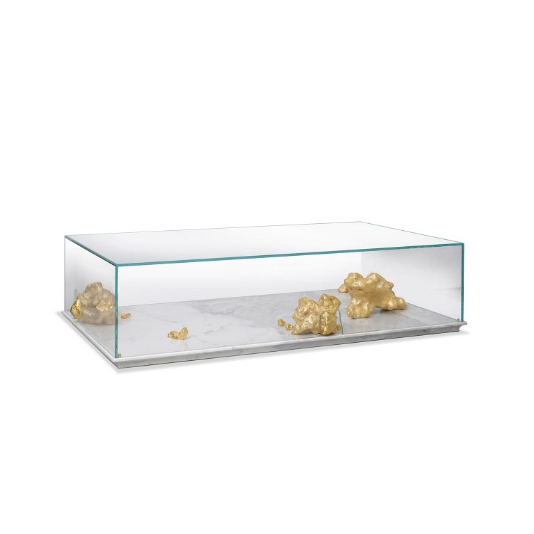 Inspiration:  
Gold has always been a metal valued by mankind as well as in the origin, development and conquest of many known civilizations. The Aurum table recreates the fascination that gold has in our lives. This piece recreates gold pure stones