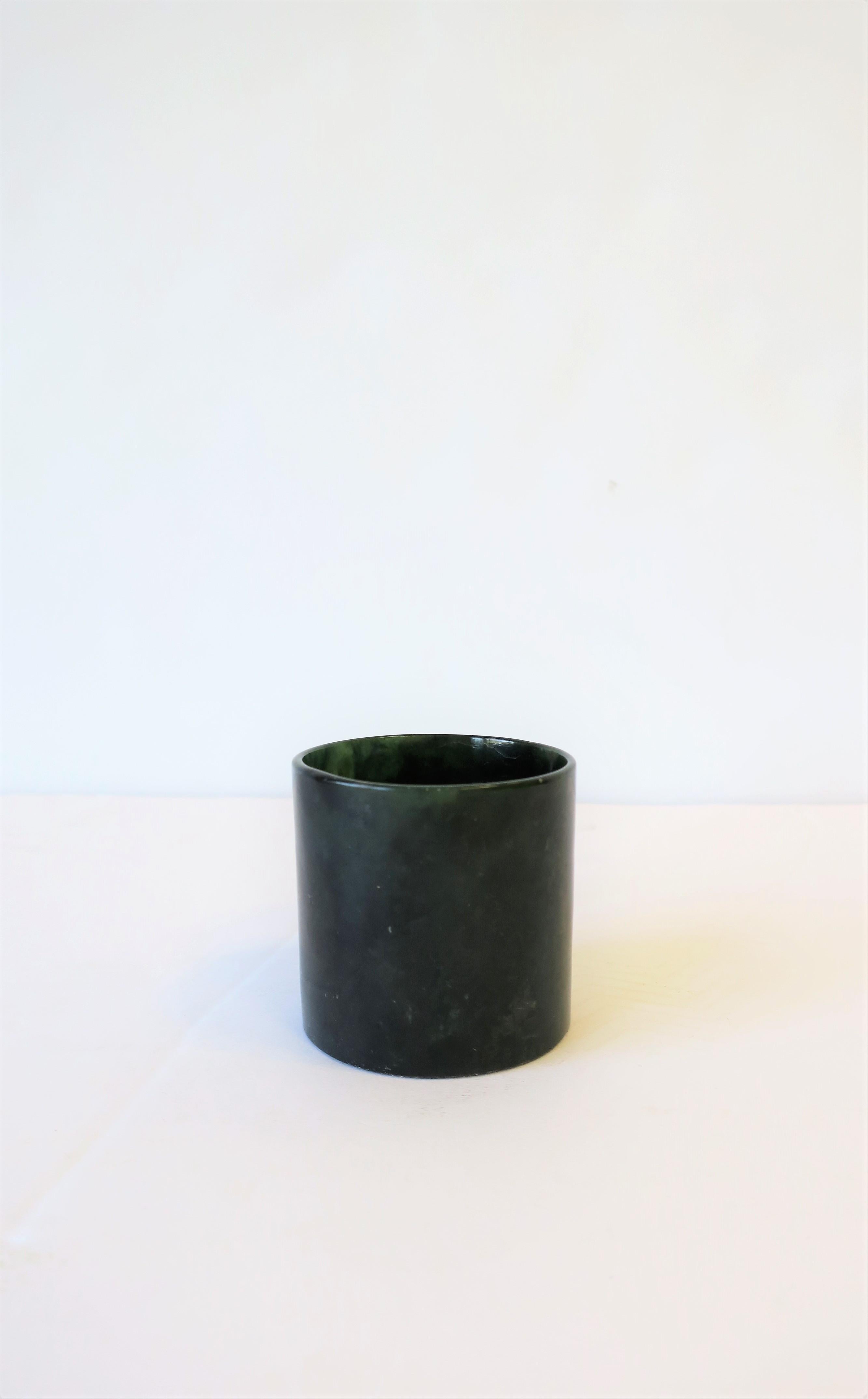 A small modern Austrian dark green marble vessel, circa 20th century, Austria. This is a great piece for a desk, bathroom vanity, or other. Marble is polished smooth inside and out. Marked 'Austria' on bottom as show in image #6.

Piece measures: