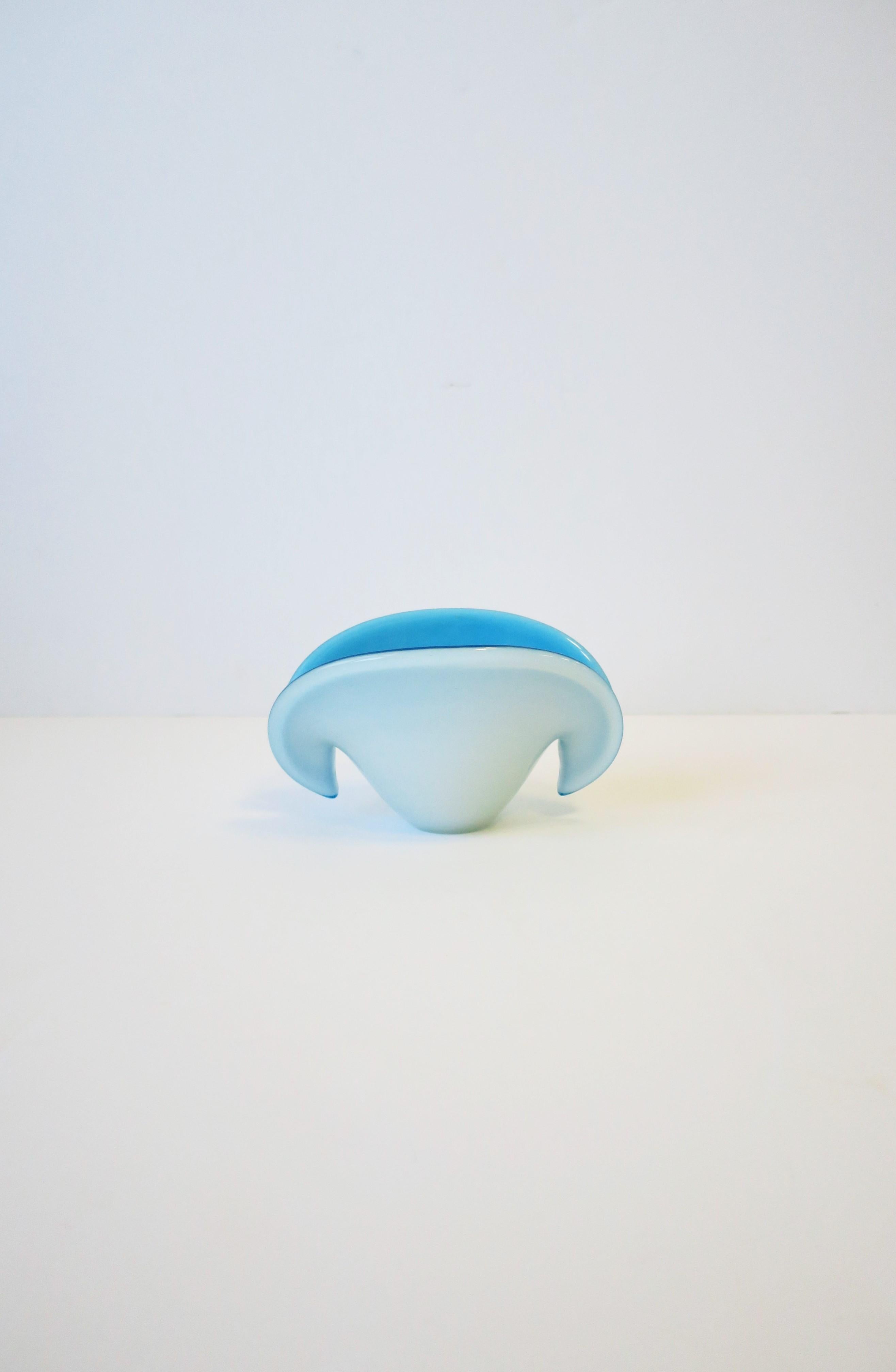 A beautiful white over azure blue (sky blue) Italian Murano art glass conch seashell bowl or vase vessel, Midcentury Modern period, circa mid-20th century, Italy. Piece can work well as a standalone object, vase or as a vide-poche (catch-all), as