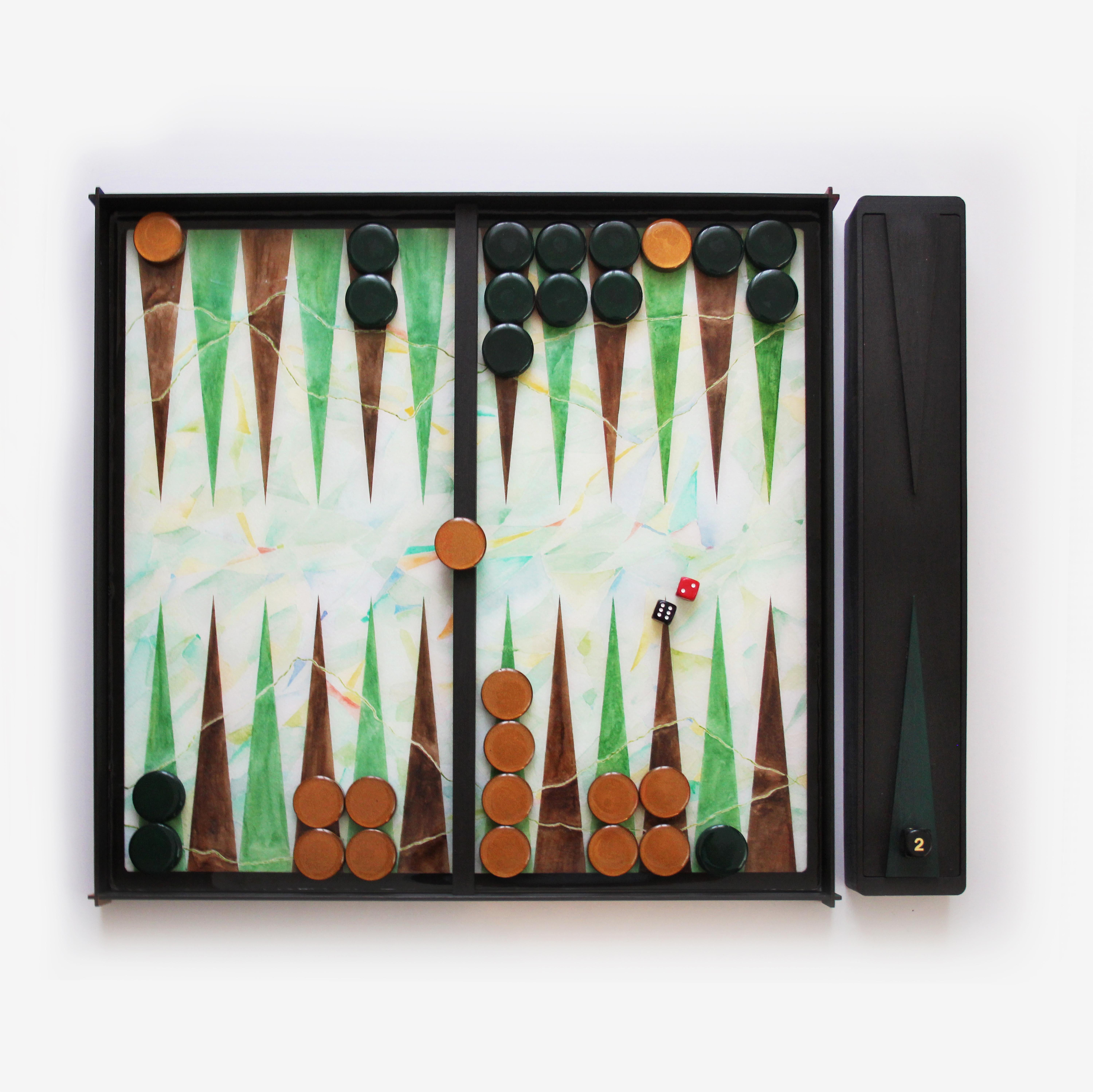 La planche de backgammon est une collection limitée (100 pièces) faite à la main et conçue par la jeune milanaise Valeria Molinari pour Dilmos Edizioni. Le projet, composé de quatre planches inspirées des éléments de l'eau, de l'air, du feu et de la