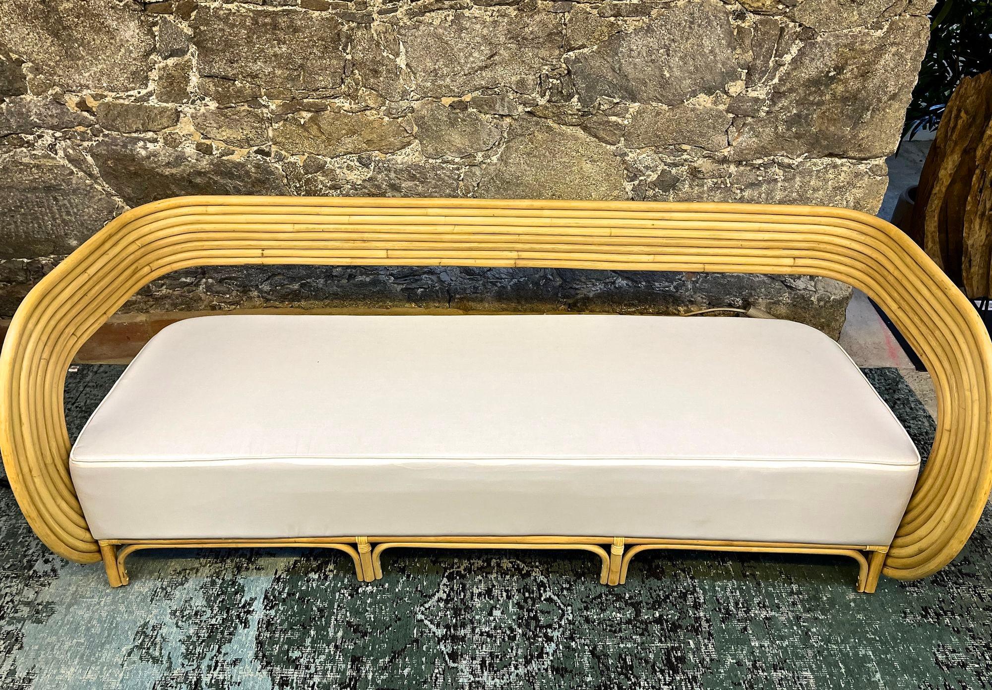 One of a kind, modern bamboo bentwood three seat sofa with comfortable white seating cushion, designed by a very talented javanese designer. This unique large contemporay sofa was made of bright bent bamboo and impresses with its amazing looking