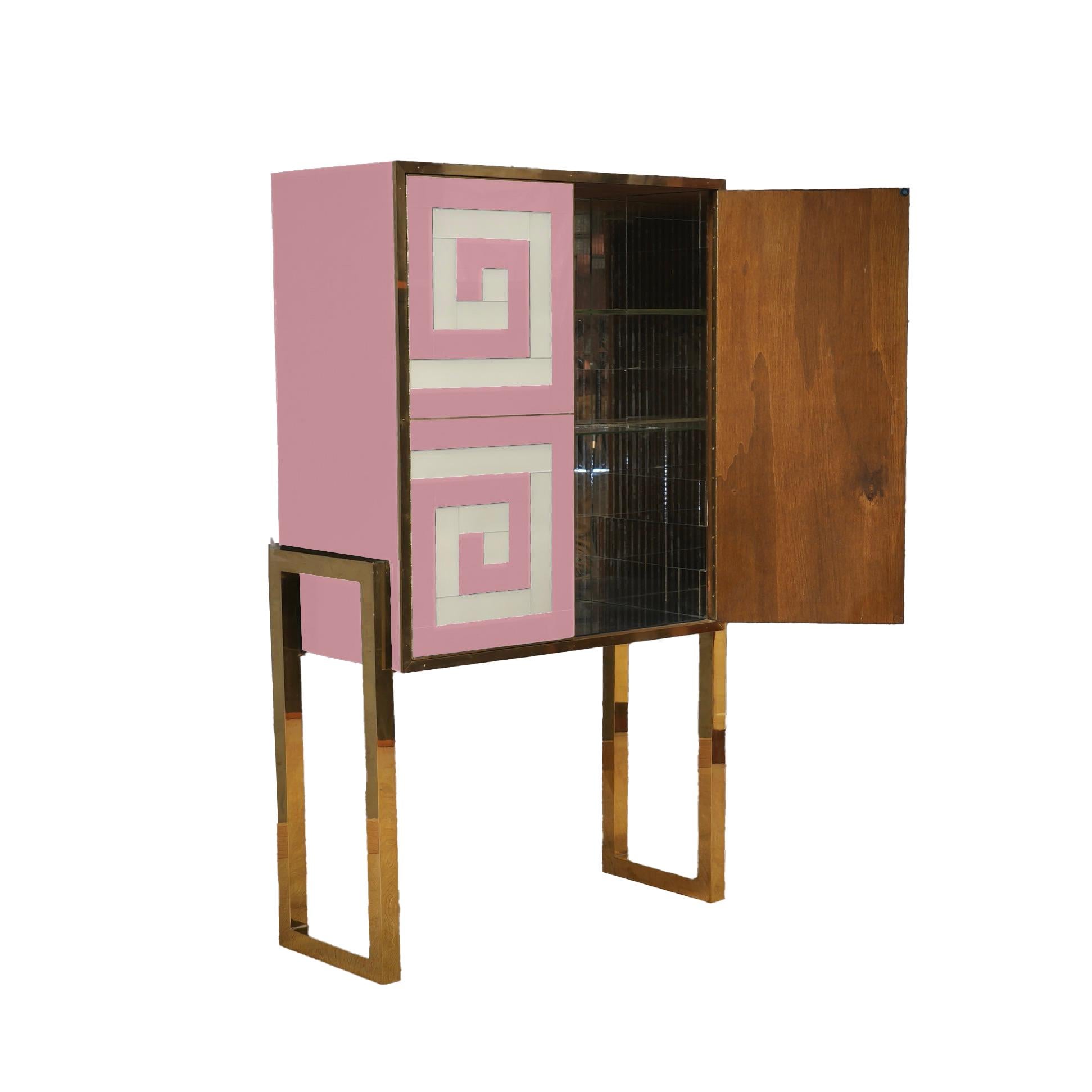Introducing the Modern Bar Cabinet in Murano Glass Pink & White with Brass Legs and Trim, a masterpiece of Italian craftsmanship that combines the timeless elegance of Murano glass with the sophistication of modern design. 

This unique bar cabinet