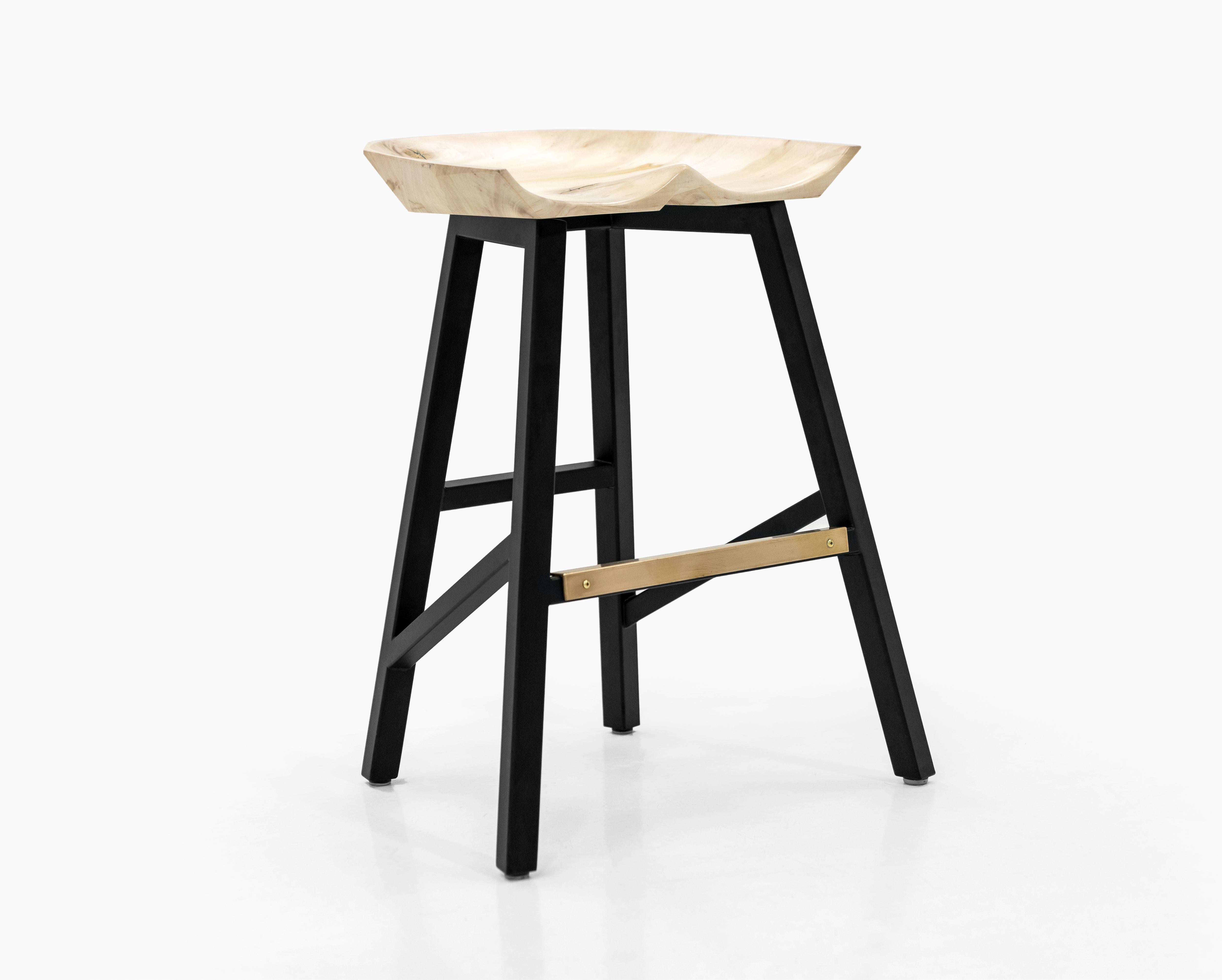 Modern tractor-seat style bar and counter stool. Shown in bleached soft maple with stainless steel legs (available in any powder-coated color) and brass kick plate. Available in 18