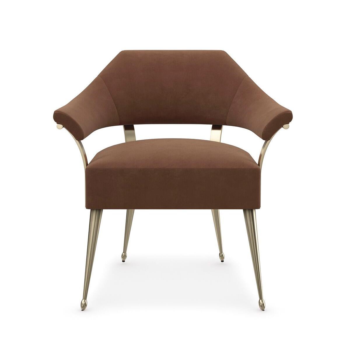 With an elegant silhouette inspired by a French antique. The chair adds classic warmth and a note of luxe with its slender frame in Champagne Gold and rust-colored mohair fabric with an exposed burl accent cinching the outside back.

Dimensions: