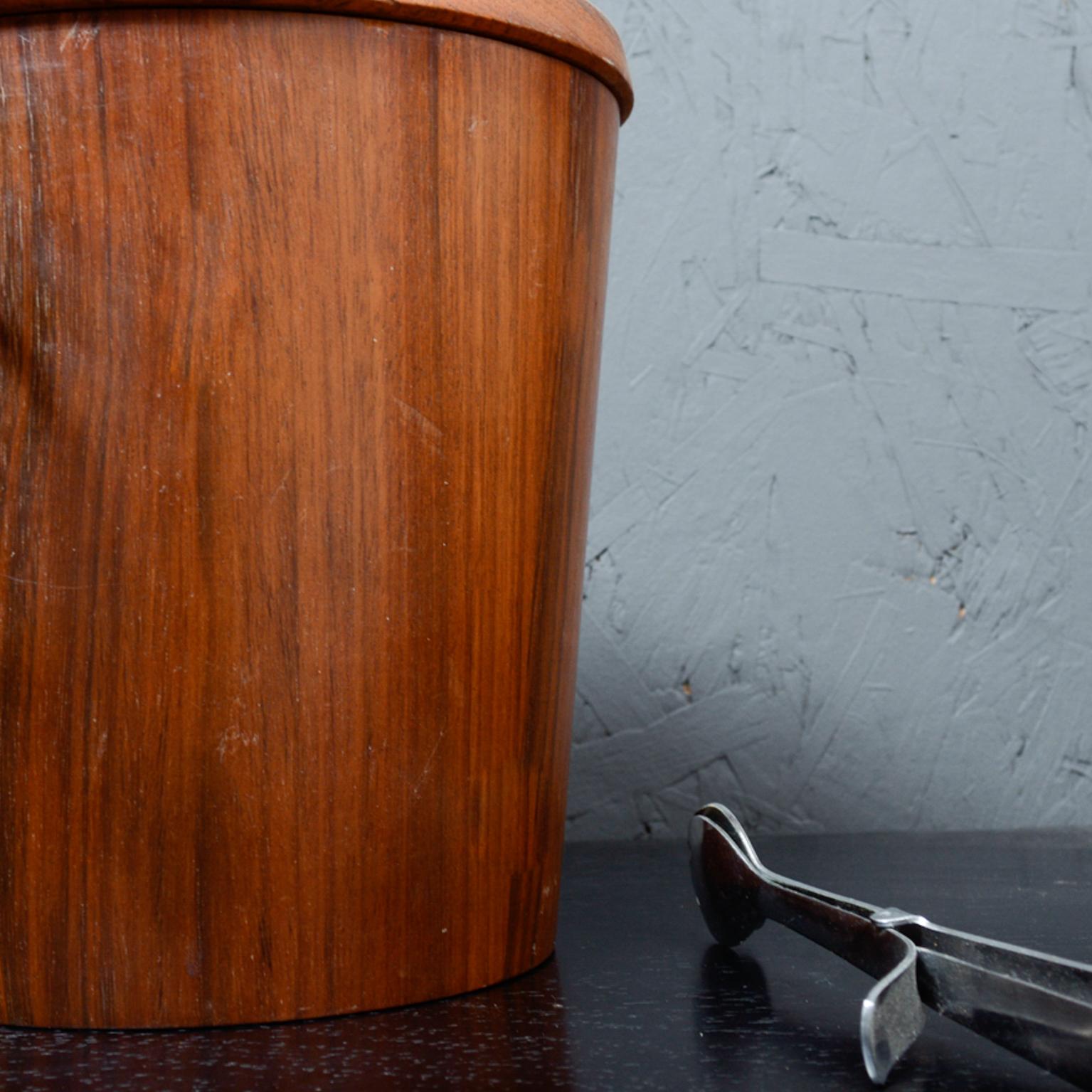 Offering MCM barware 1960s:
Mid-Century Modern walnut wood ice bucket barware set with Nevco stainless steel tongs 1960s
Ice bucket has aluminum liner. Includes stainless steel tongs by Nevco labeled from Japan.
Dimensions: Ice bucket 9 .5 tall x