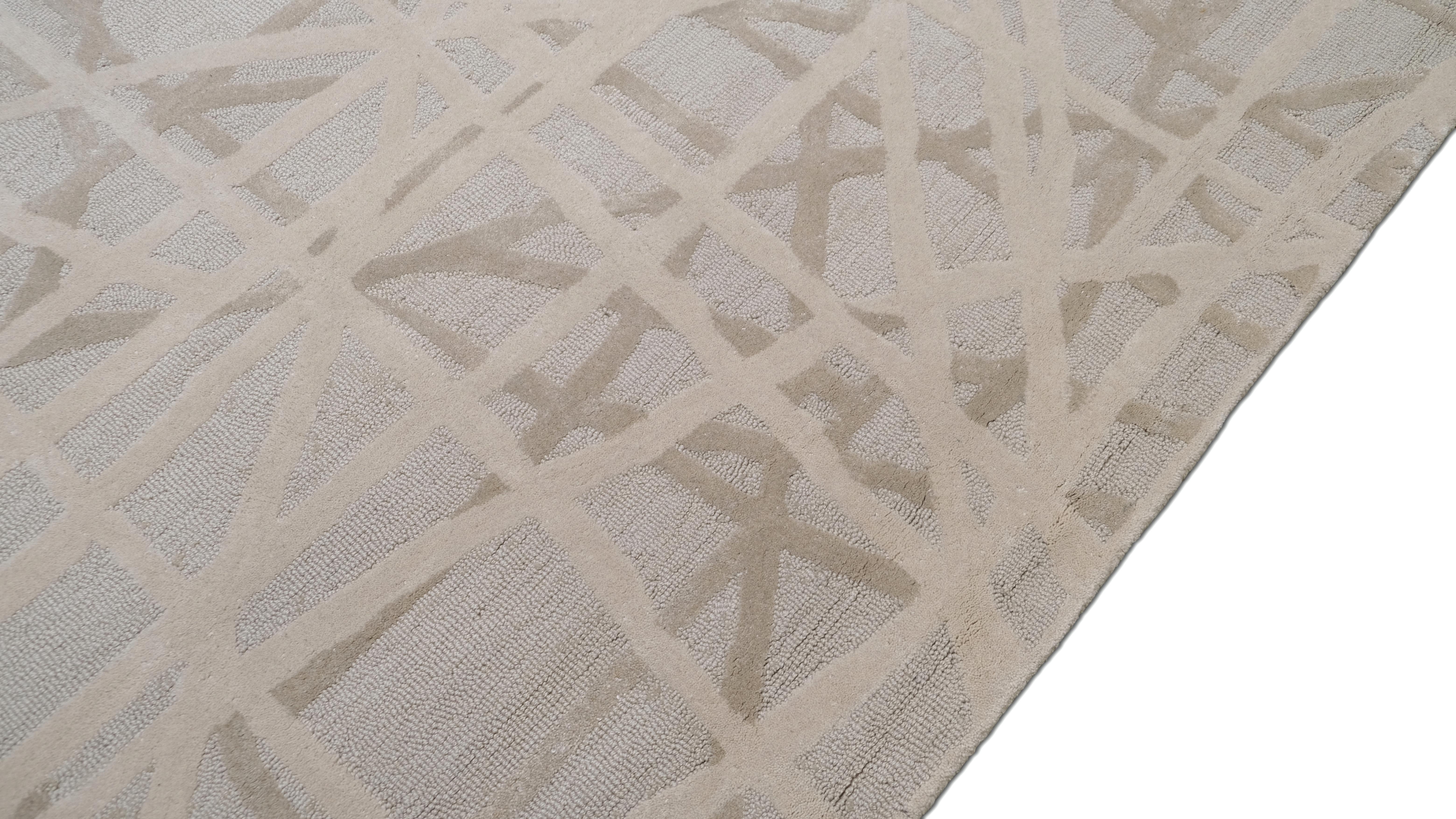 Add a touch of modern artistry to your space with this handmade wool rug, featuring a striking abstract linear pattern in soft neutral hues. The beige and ivory intersecting lines create an eye-catching yet balanced composition, making this rug an