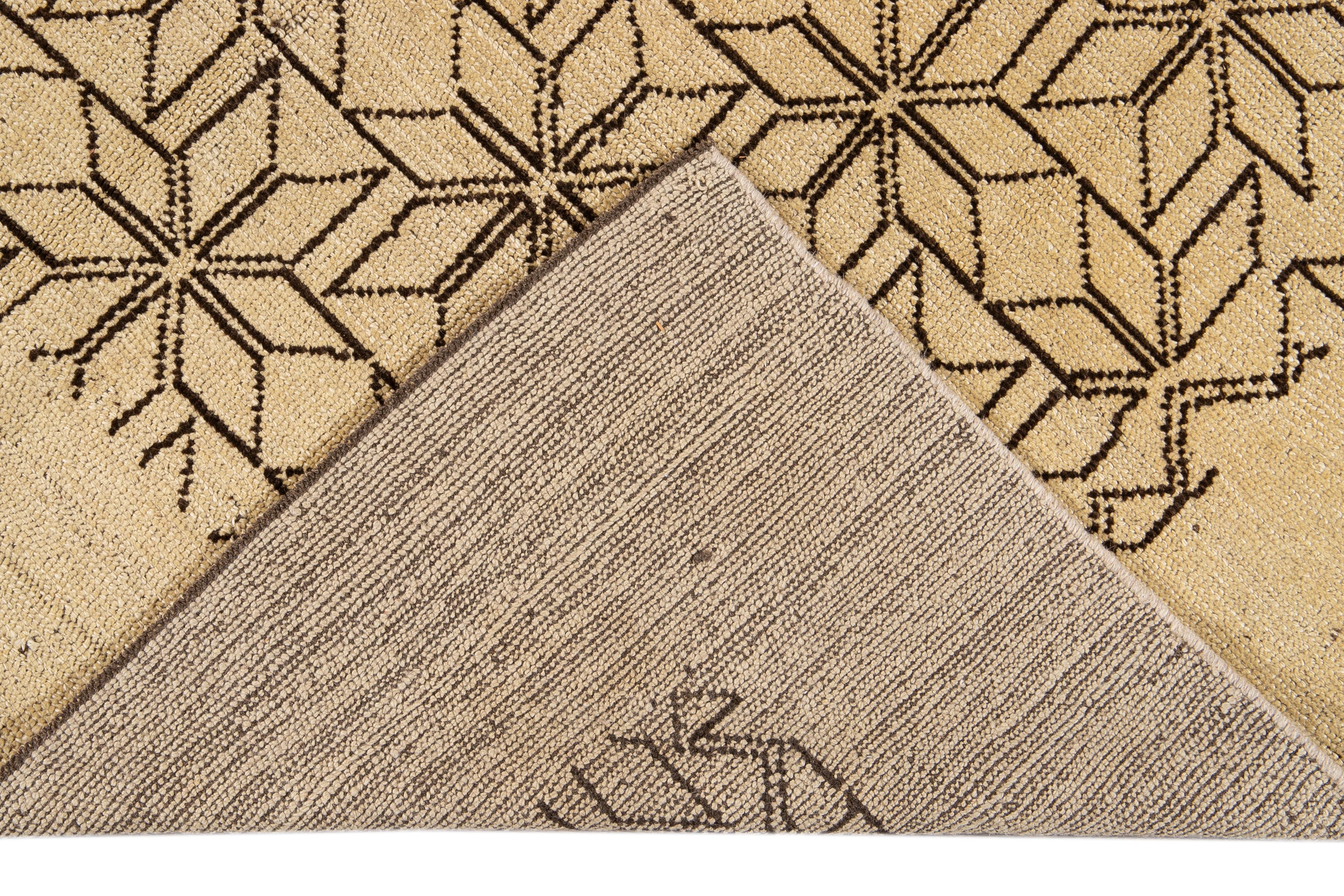 Beautiful modern Deco-style hand-knotted wool rug with a beige field. This Contemporary rug has accents of brown in a gorgeous all-over geometric floral pattern design.

This rug measures: 6'9