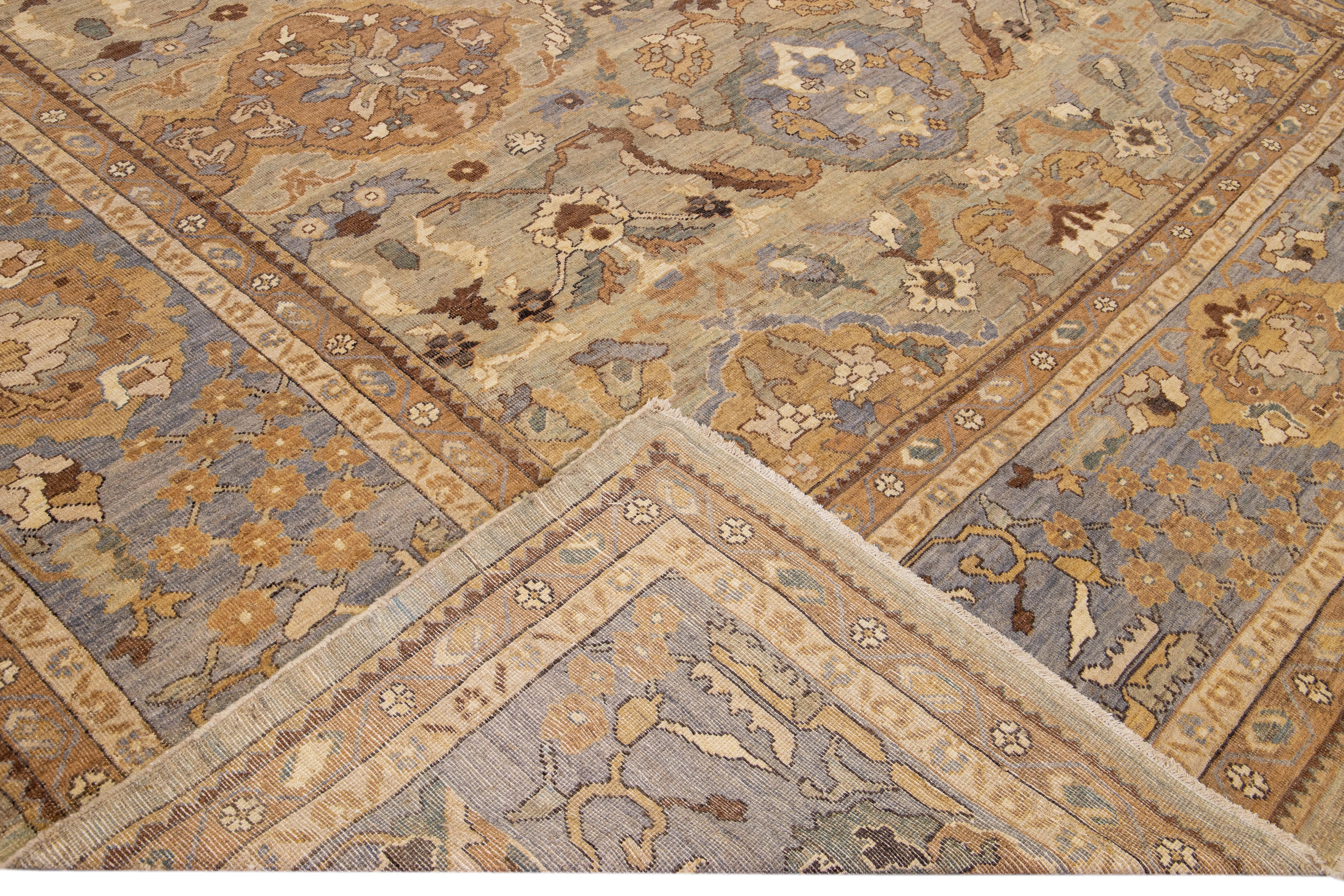 Beautiful modern Sultanabad hand-knotted wool rug with a beige field. This Sultanabad rug has a gray frame with beige, blue, brown, and goldenrod accent in a gorgeous all-over Classic floral pattern design.

This rug measures: 13' x 20'6