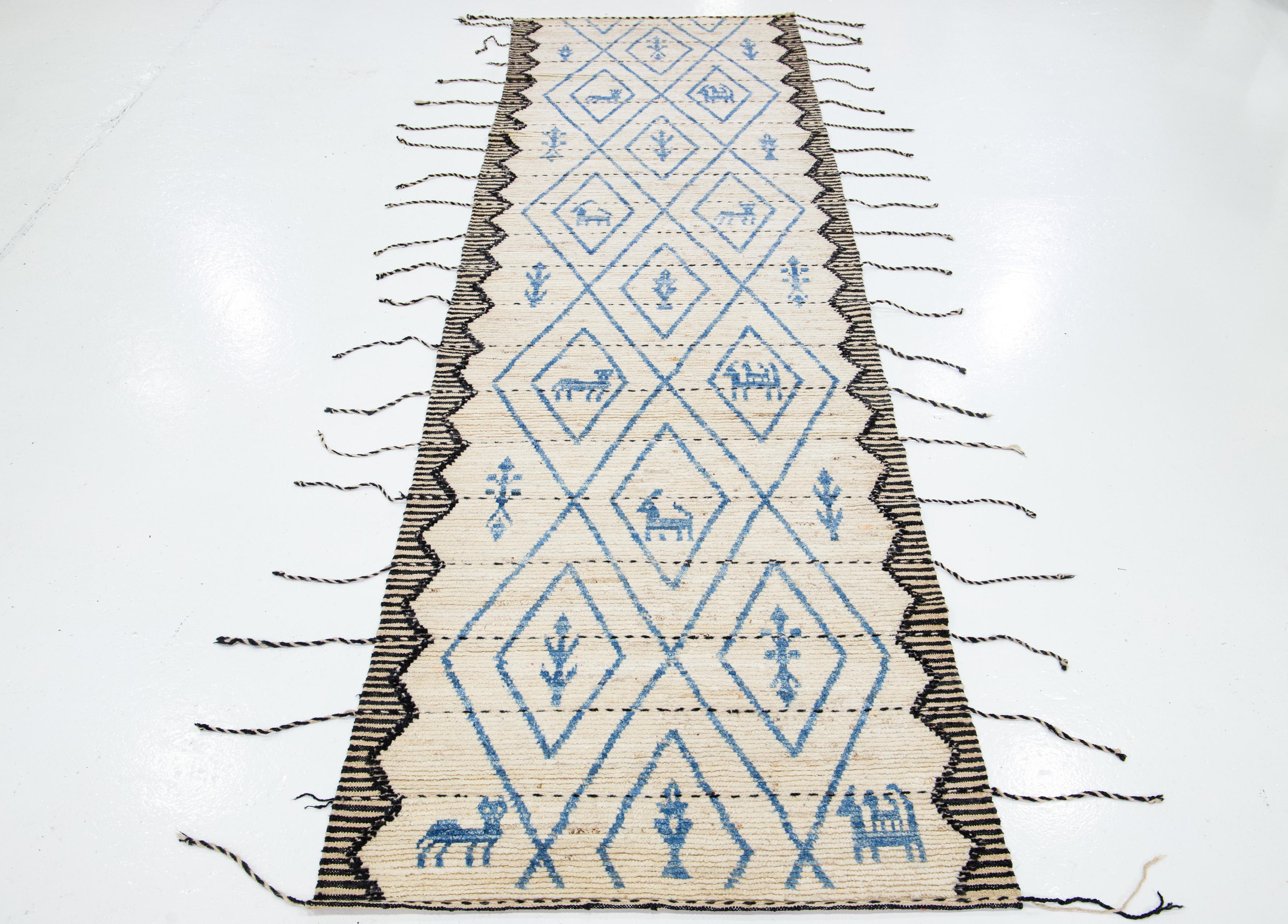 Contemporary Modern Beige Moroccan Style Wool Runner With Blue Tribal Motif For Sale