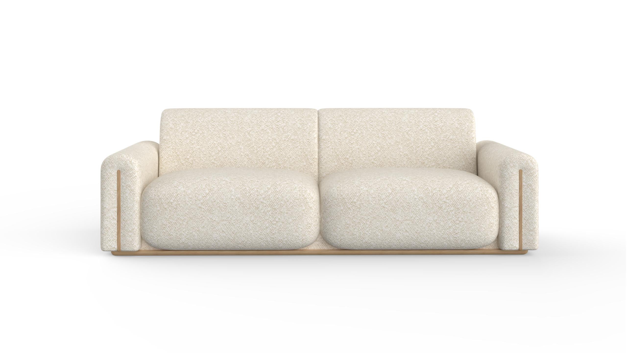 Beijinho Sofa, Contemporary Collection, Handcrafted in Portugal - Europe by Greenapple.

The Beijinho seamlessly combines the soft texture of the DEDAR cotton-wool bouclé and enveloping, tufted comfort, creating a sensory experience reminiscent of a