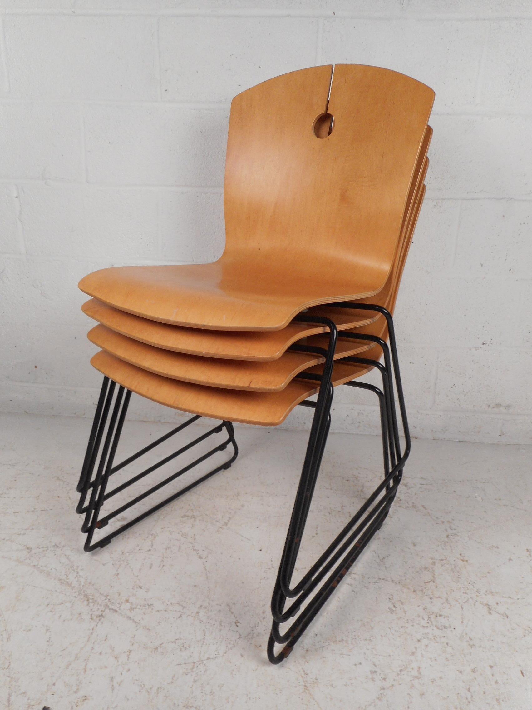 Sleek set of bentwood stacking chairs made by Wieland. Simple yet stylish design with a keyhole accent at the peak of the backrests. Supported by metal frames. Dynamic seating solution, easy to store when not in use. Sure to please in any modern