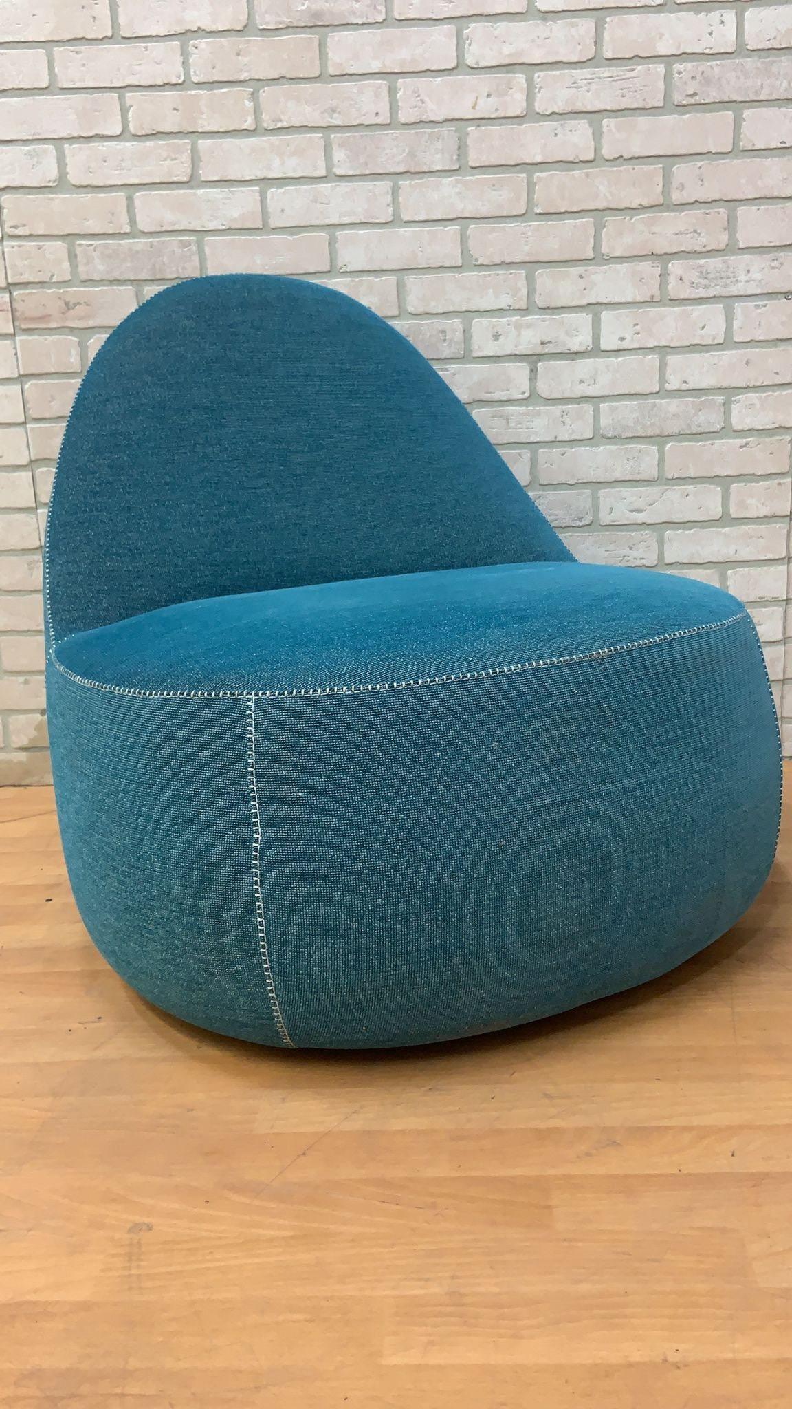 Modern Bernhardt Design Mitt lounge chair in Lagoon blue with white stitching with handle 

The Mitt Lounge designed by El Salvadoran Designers Harry and Claudia Washington for Bernhardt Design. The Chair’s Comfortable and Relaxed form,
