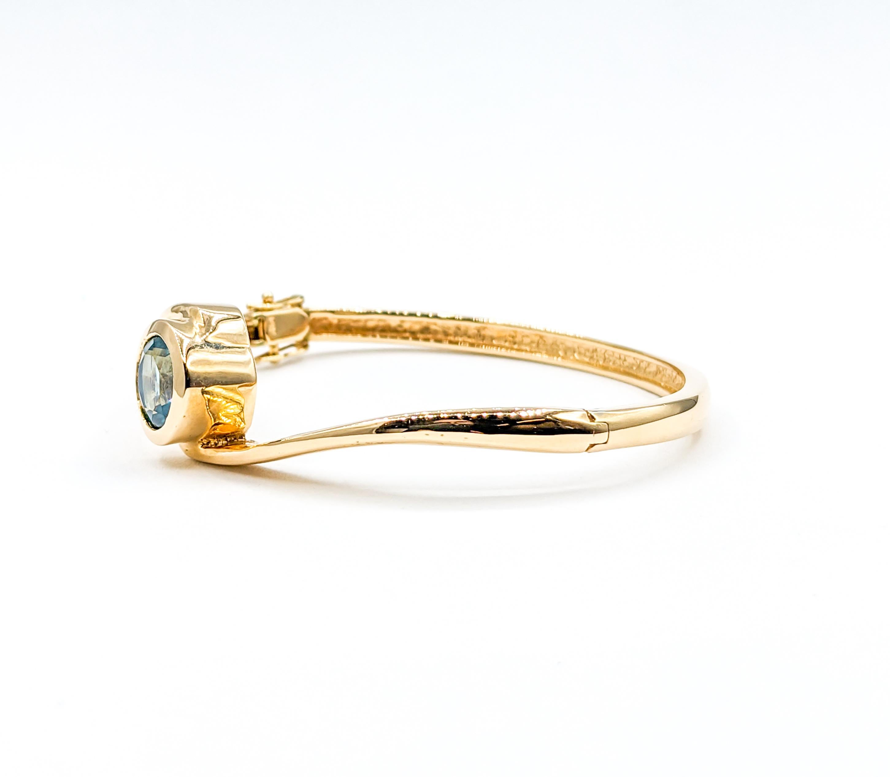 Modern Bezel Set Blue Topaz Hinge Bangle Bracelet in Yellow Gold For Sale 4